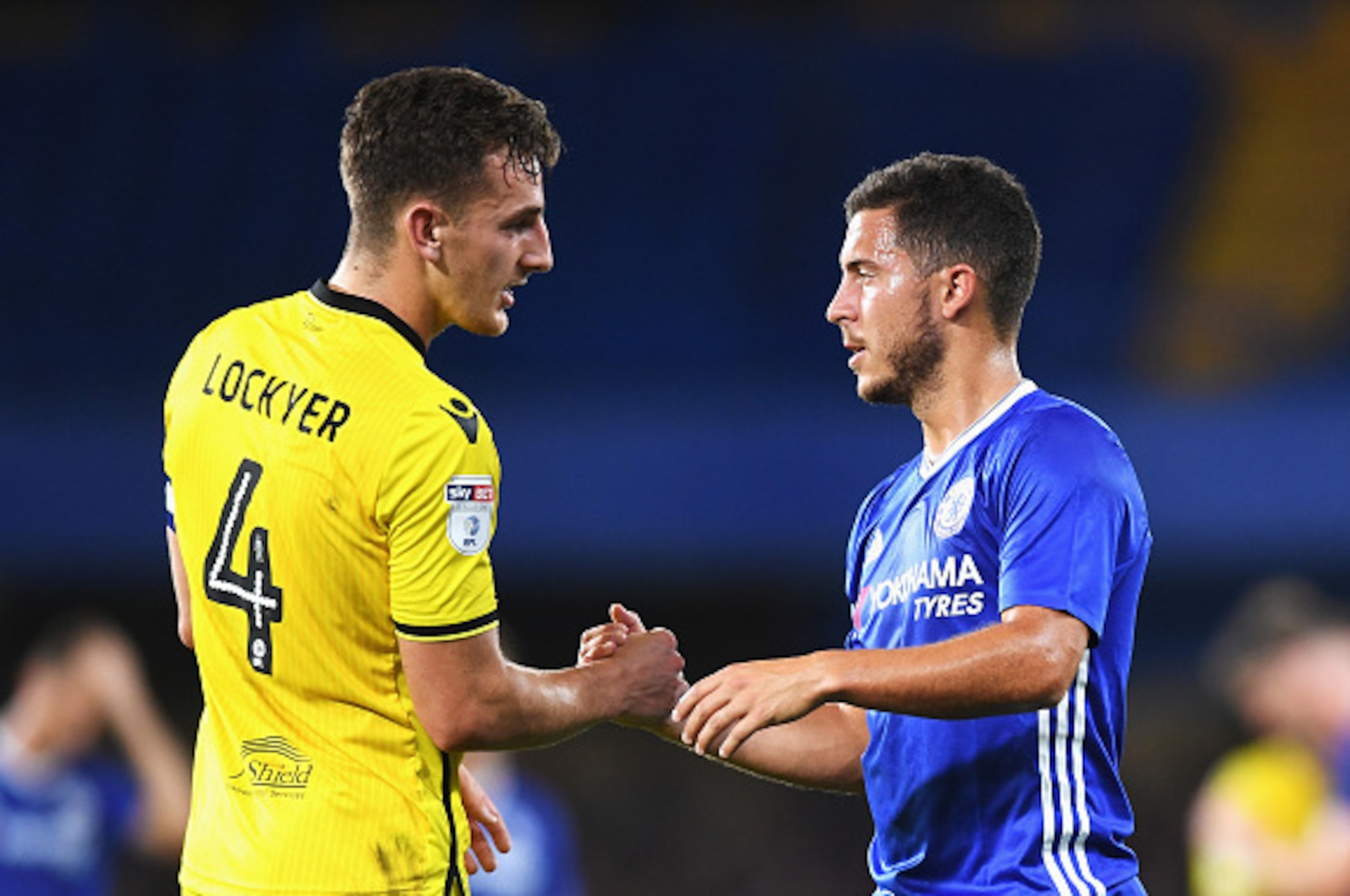 LONDON, ENGLAND - AUGUST 23: Eden Hazard of Chelsea shakes hands with Tom Lockyer of Bristol Rovers after the EFL Cup second round match between Chelsea and Bristol Rovers at Stamford Bridge on August 23, 2016 in London, England.  (Photo by Michael Regan/