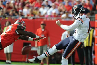 TAMPA, FL - DECEMBER 27: Linebacker Jeremiah George #52 of the Tampa Bay Buccaneers blocks a punt by punter Pat O'Donnell #16 of the Chicago Bears in the first quarter at Raymond James Stadium on December 27, 2015 in Tampa, Florida. (Photo by Cliff McBrid