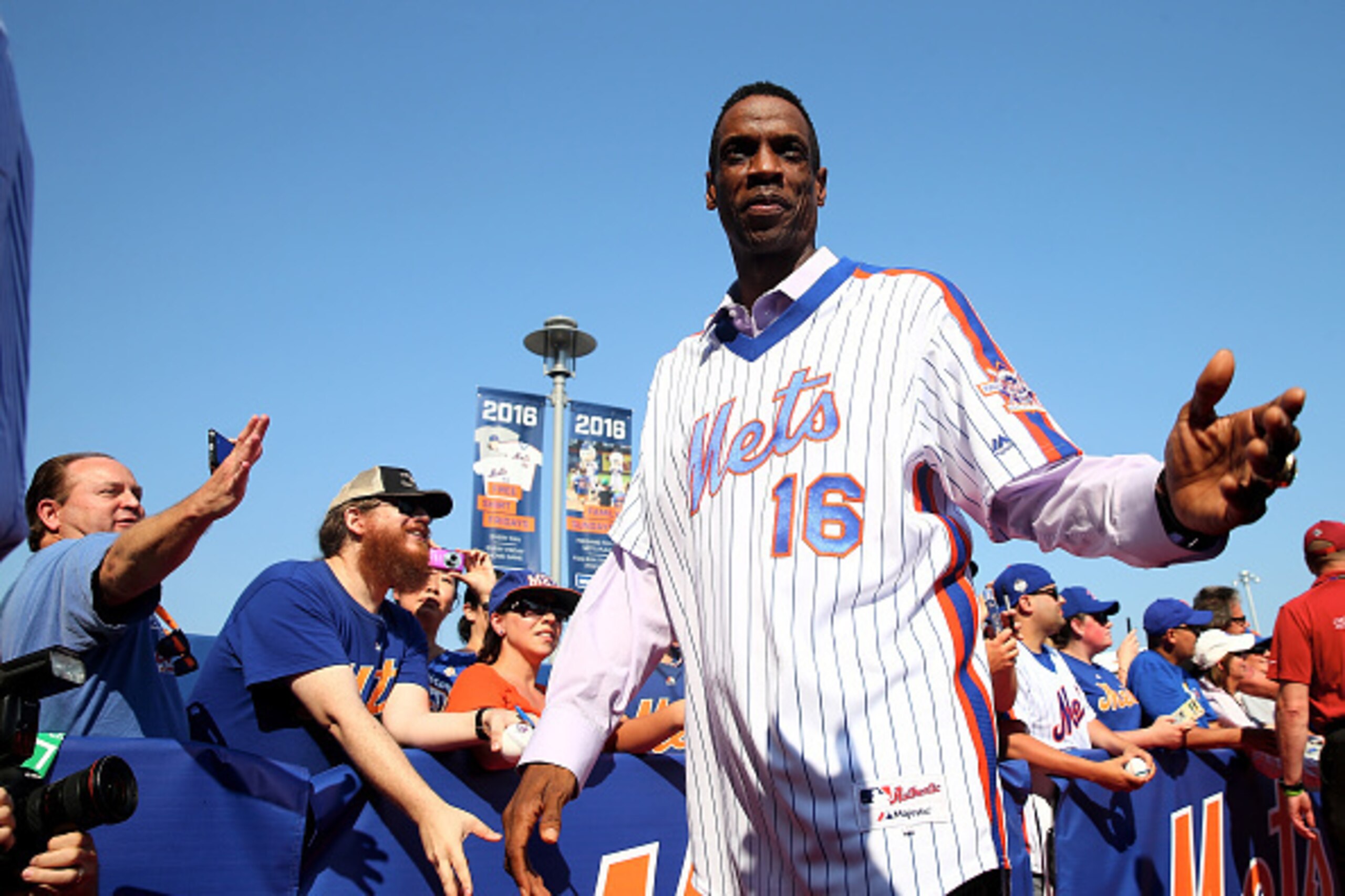 NEW YORK, NY - MAY 28:  Dwight Gooden #16 of the 1986 New York Mets greets fans on the red carpet before the game between the New York Mets and the Los Angeles Dodgers at Citi Field on May 28, 2016 in the Flushing neighborhood of the Queens borough of New