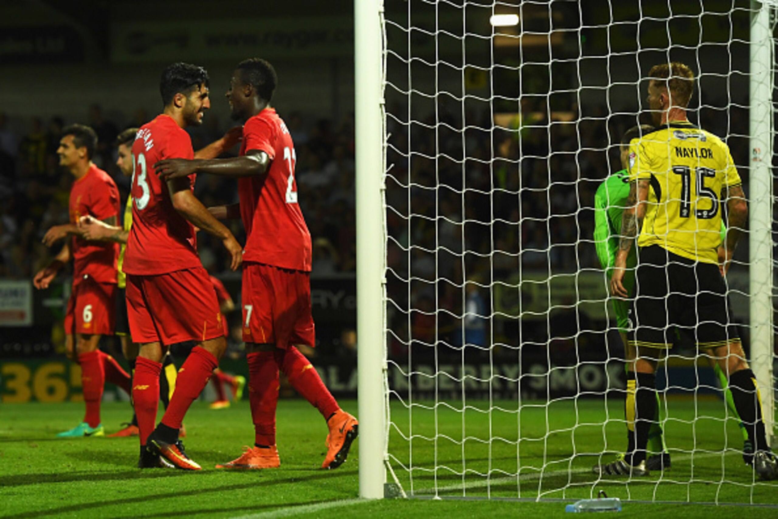 BURTON UPON TRENT, ENGLAND - AUGUST 23: Emre Can (L) and Divock Origi of Liverpool celebrate the own goal scored by Tom Naylor of Burton Albion during the EFL Cup second round match between Burton Albion and Liverpool at Pirelli Stadium on August 23, 2016