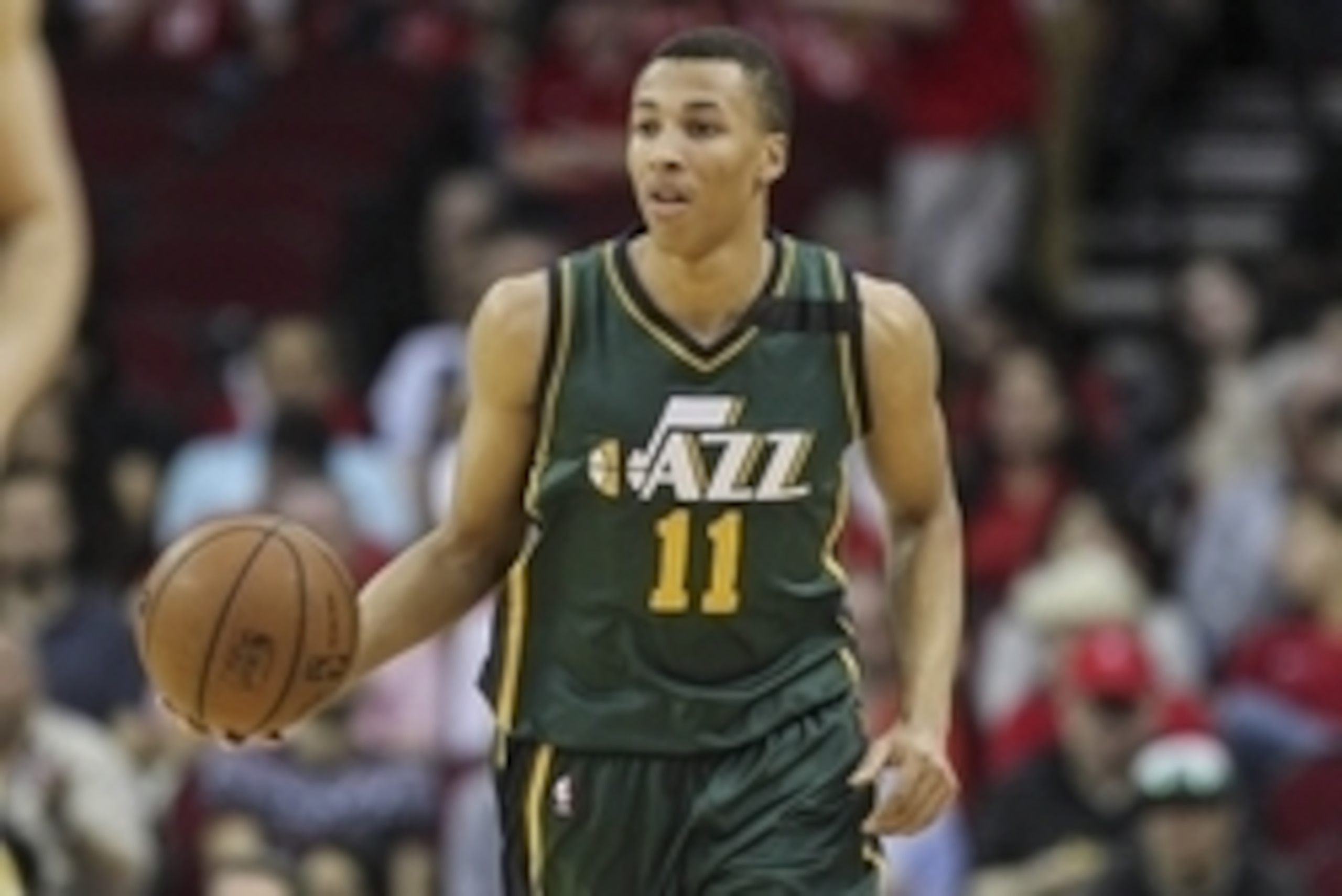 Apr 15, 2015; Houston, TX, USA; Utah Jazz guard Dante Exum (11) brings the ball up the court during the first quarter against the Houston Rockets at Toyota Center. Mandatory Credit: Troy Taormina-USA TODAY Sports