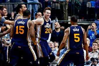 Feb 9, 2016; Dallas, TX, USA; Utah Jazz forward Gordon Hayward (20) celebrates with guard Rodney Hood (5) and  forward Derrick Favors (15) after making the game winning shot in overtime to defeat the Dallas Mavericks at American Airlines Center. Mandatory