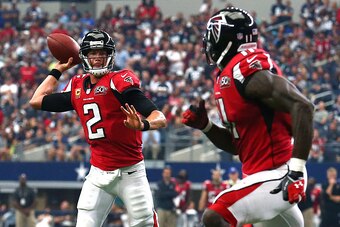 ARLINGTON, TX - SEPTEMBER 27: Matt Ryan #2 of the Atlanta Falcons throws a touchdown pass to teammate Julio Jones #11 against the the Dallas Cowboys in the fourth quarter at AT&T Stadium on September 27, 2015 in Arlington, Texas. (Photo by Tom Pennington/