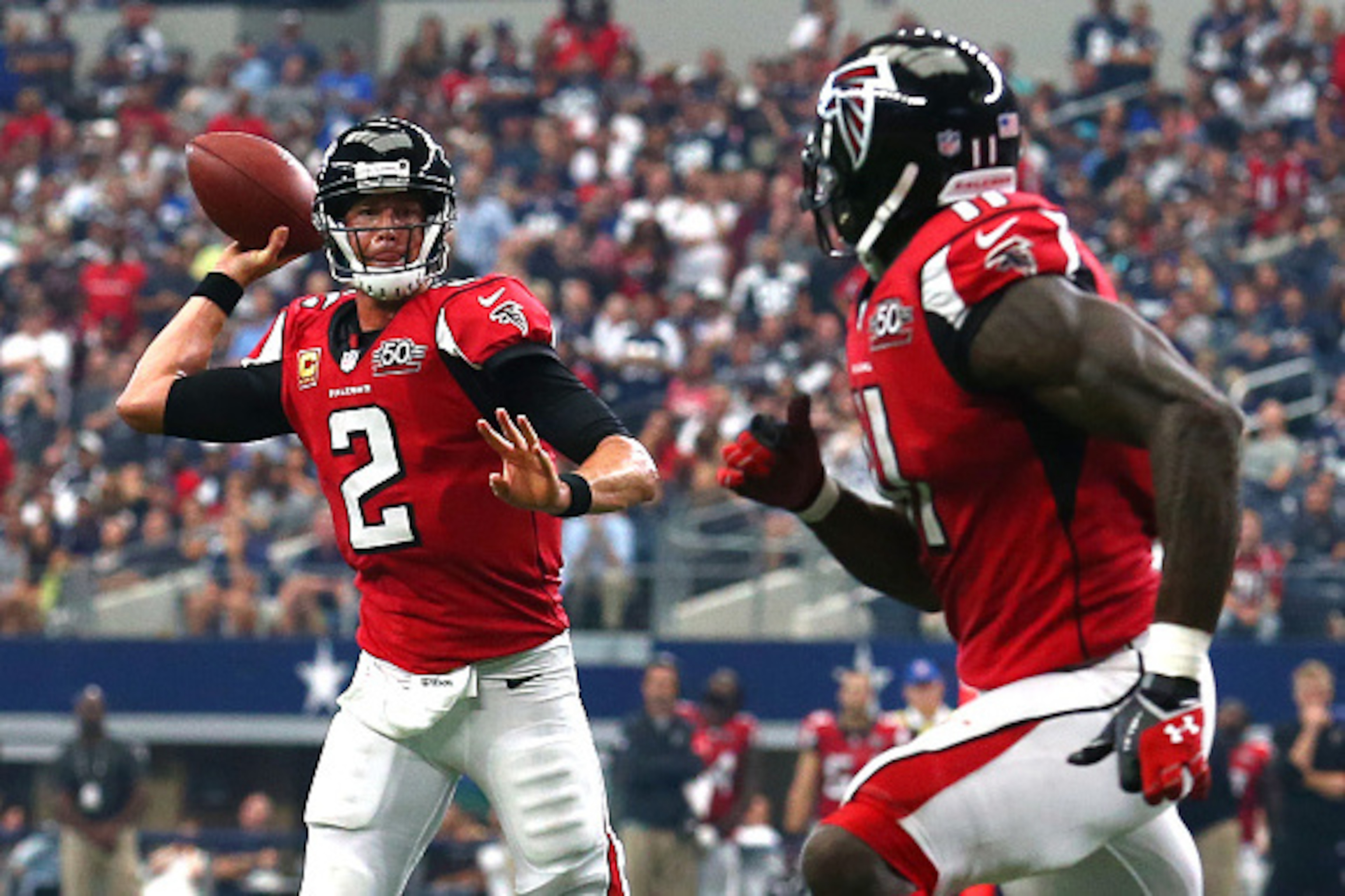ARLINGTON, TX - SEPTEMBER 27: Matt Ryan #2 of the Atlanta Falcons throws a touchdown pass to teammate Julio Jones #11 against the the Dallas Cowboys in the fourth quarter at AT&T Stadium on September 27, 2015 in Arlington, Texas. (Photo by Tom Pennington/