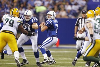 INDIANAPOLIS, IN - AUGUST 26: Curtis Painter #7 of the Indianapolis Colts looks to pass during an NFL preseason game against the Green Bay Packers at Lucas Oil Stadium on August 26, 2011 in Indianapolis, Indiana. The Packers won 24-21. (Photo by Joe Robbi
