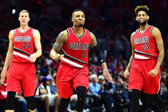 LOS ANGELES, CA - APRIL 27:  Damian Lillard #0 of the Portland Trail Blazers reacts as he heads to the bench with Mason Plumlee #24 and Allen Crabbe #23 leading the Los Angeles Clippers late during the fourth quarter in Game Five of the Western Conference