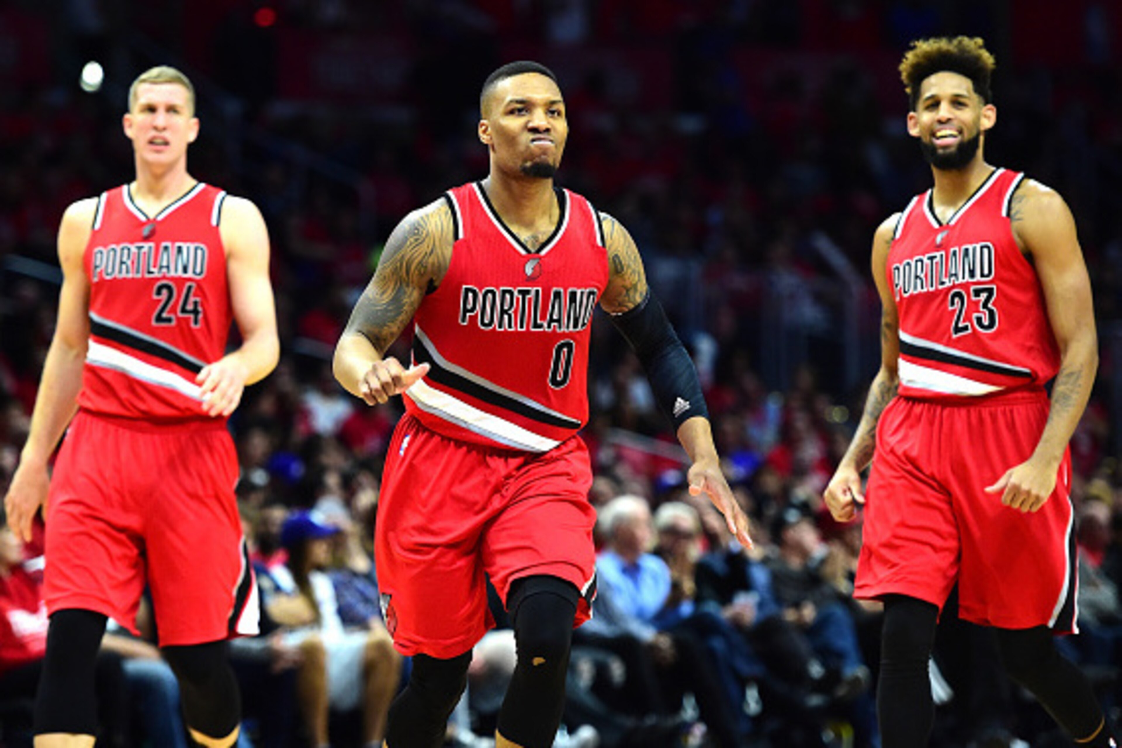 LOS ANGELES, CA - APRIL 27:  Damian Lillard #0 of the Portland Trail Blazers reacts as he heads to the bench with Mason Plumlee #24 and Allen Crabbe #23 leading the Los Angeles Clippers late during the fourth quarter in Game Five of the Western Conference