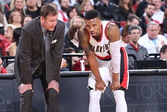 PORTLAND, OR - MARCH 23:  Head Coach Terry Stotts of the Portland Trail Blazers and Damian Lillard #0 of the Portland Trail Blazers looks on during the game against the Dallas Mavericks on March 23, 2016 at the Moda Center in Portland, Oregon. NOTE TO USE