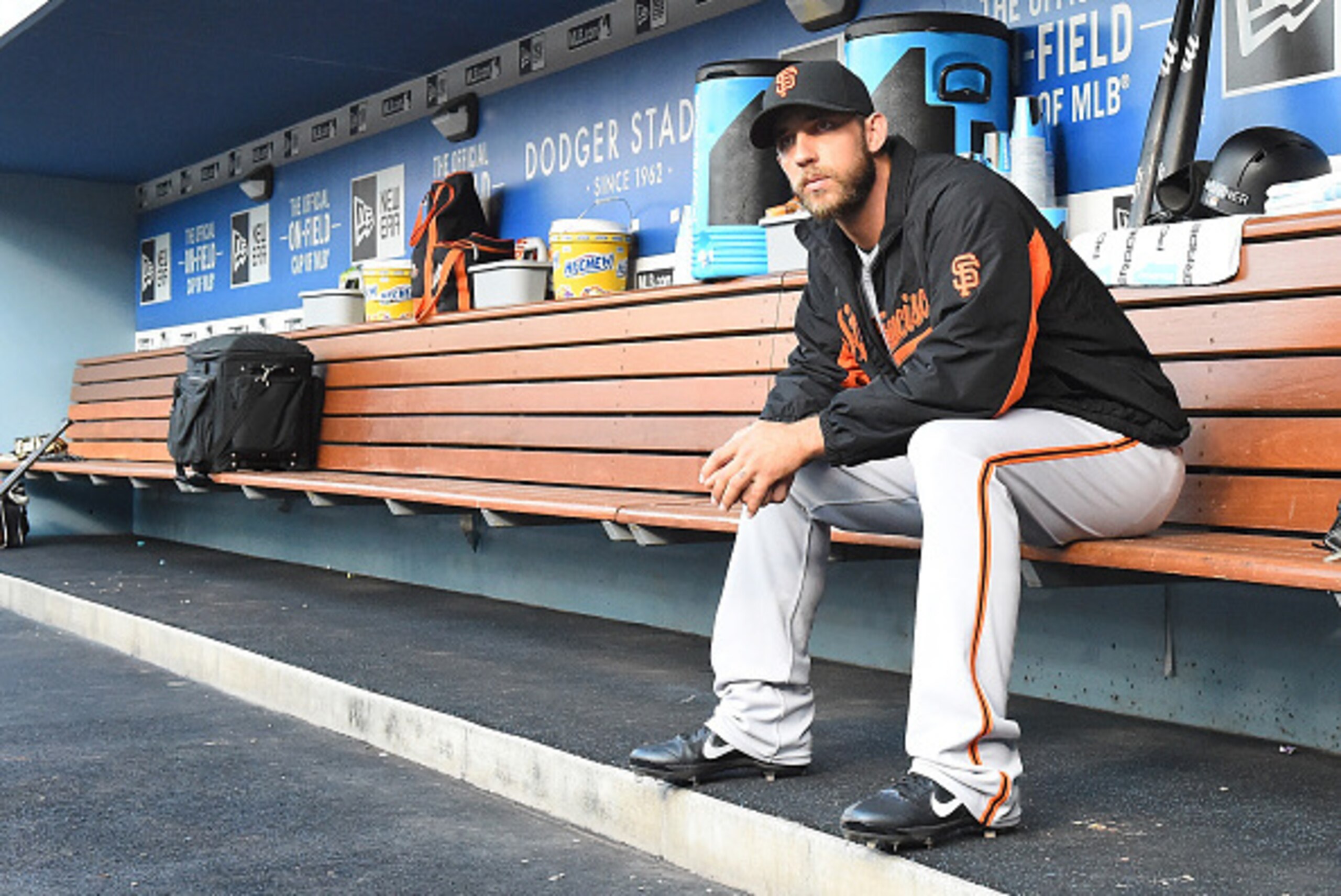LOS ANGELES, CA - AUGUST 23:  Madison Bumgarner #40 of the San Francisco Giants sits in the dugout before the start of the game against the Los Angeles Dodgers at Dodger Stadium on August 23, 2016 in Los Angeles, California.  (Photo by Jayne Kamin-Oncea/G