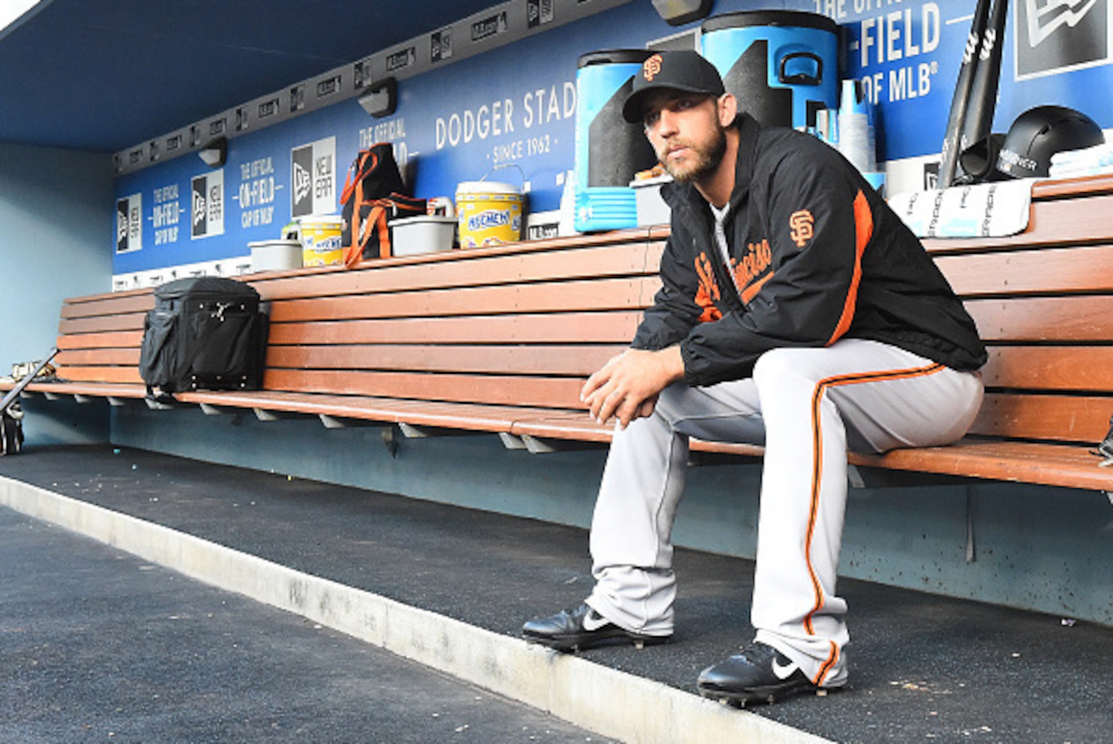 LOS ANGELES, CA - AUGUST 23:  Madison Bumgarner #40 of the San Francisco Giants sits in the dugout before the start of the game against the Los Angeles Dodgers at Dodger Stadium on August 23, 2016 in Los Angeles, California.  (Photo by Jayne Kamin-Oncea/G