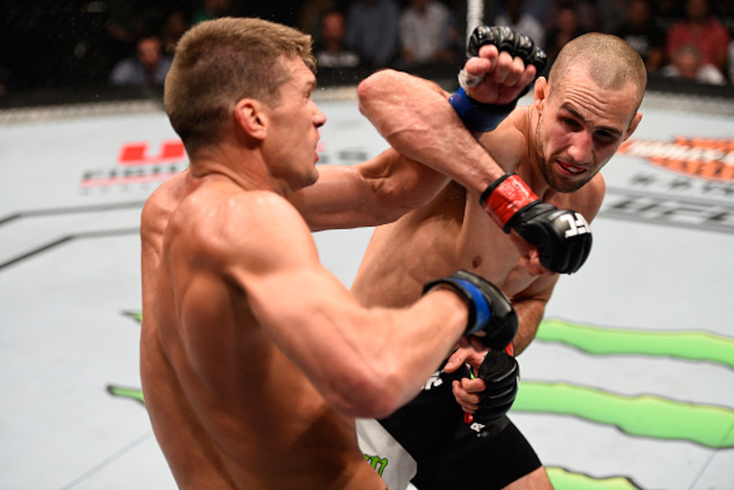 OTTAWA, ON - JUNE 18:   (R-L) Rory MacDonald of Canada punches Stephen Thompson of the United States in their welterweight bout during the UFC Fight Night event inside the TD Place Arena on June 18, 2016 in Ottawa, Ontario, Canada. (Photo by Jeff Bottari/