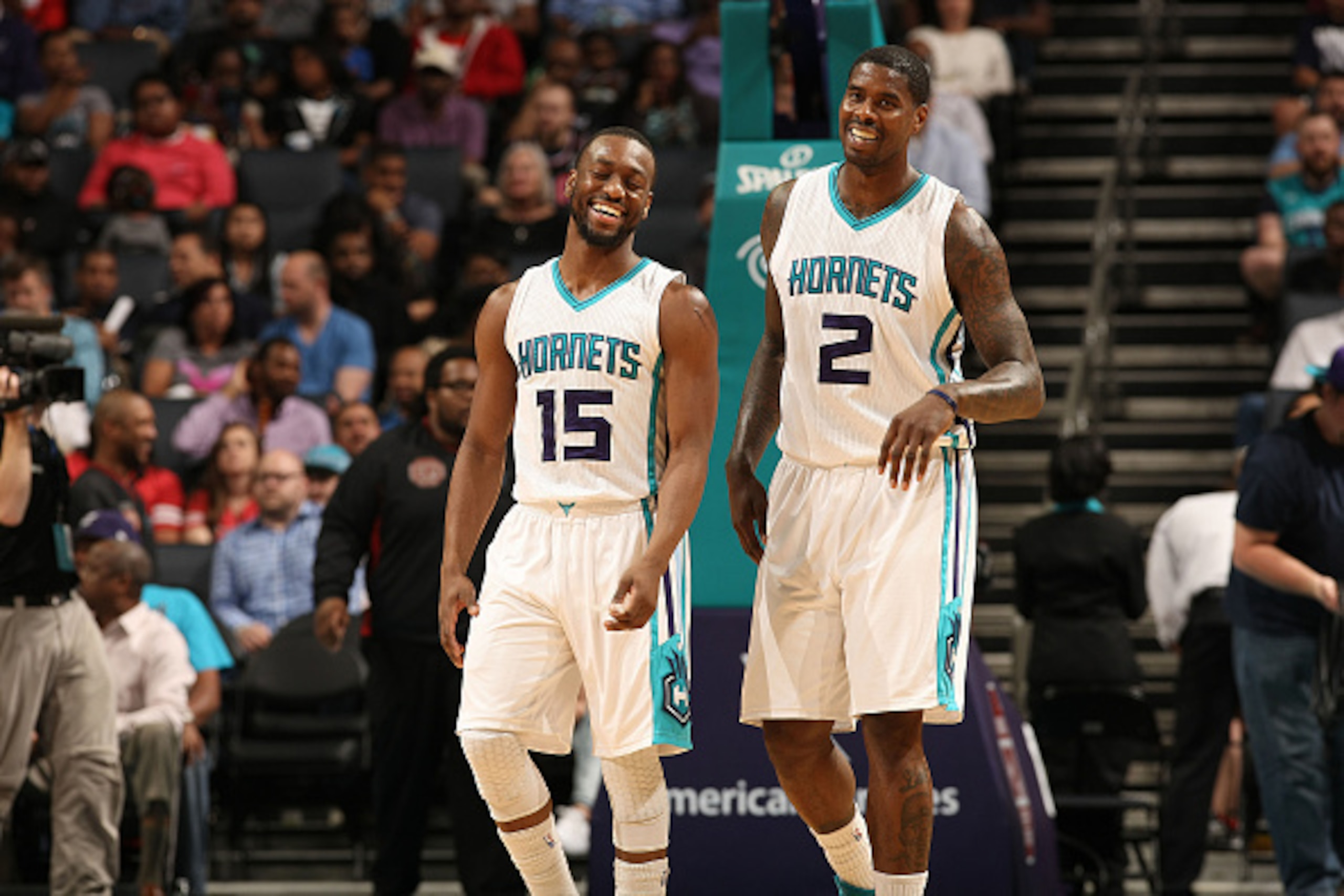 CHARLOTTE, NC - APRIL 13: Kemba Walker #15 and Marvin Williams #2 of the Charlotte Hornets smile during the game against the Houston Rockets at the Time Warner Cable Arena on April 13, 2015 in Charlotte, North Carolina. NOTE TO USER: User expressly ackno CHARLOTTE, NC - APRIL 13: Kemba Walker #15 and Marvin Williams #2 of the Charlotte Hornets smile during the game against the Houston Rockets at the Time Warner Cable Arena on April 13, 2015 in Charlotte, North Carolina. NOTE TO USER: User expressly ackno