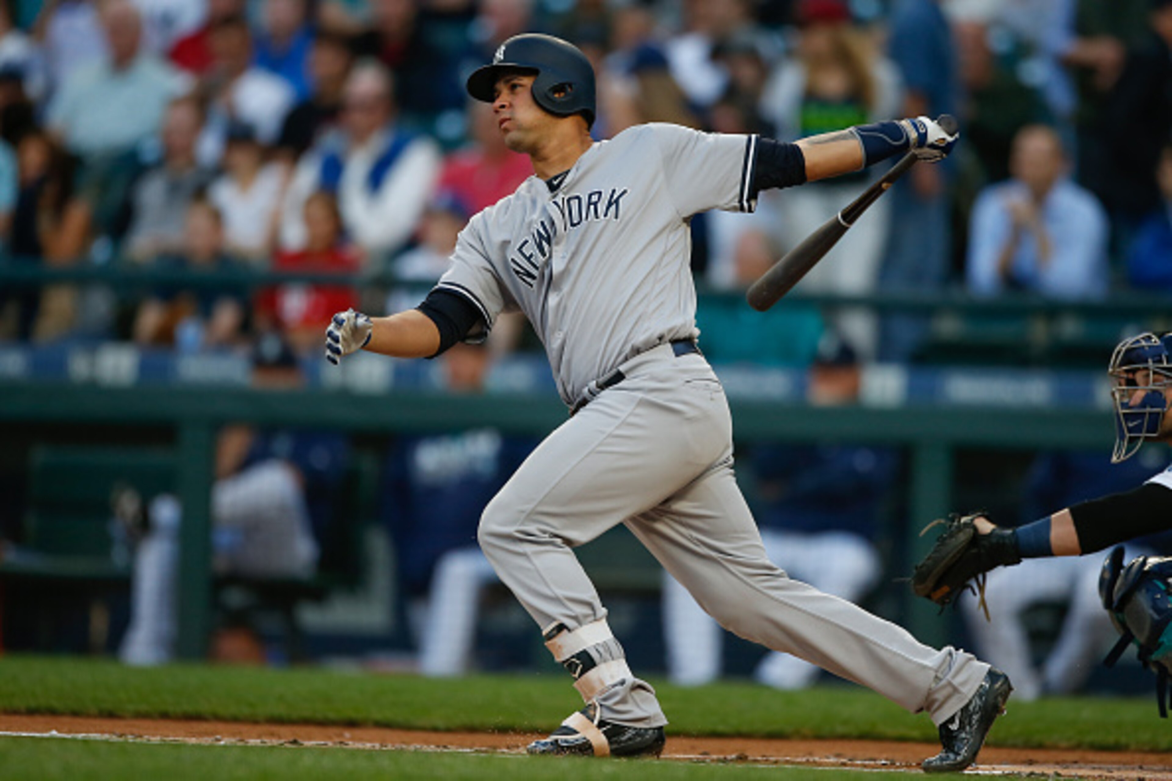 SEATTLE, WA - AUGUST 22:  Gary Sanchez #24 of the New York Yankees hits a home run against the Seattle Mariners in the first inning at Safeco Field on August 22, 2016 in Seattle, Washington.  (Photo by Otto Greule Jr/Getty Images)
