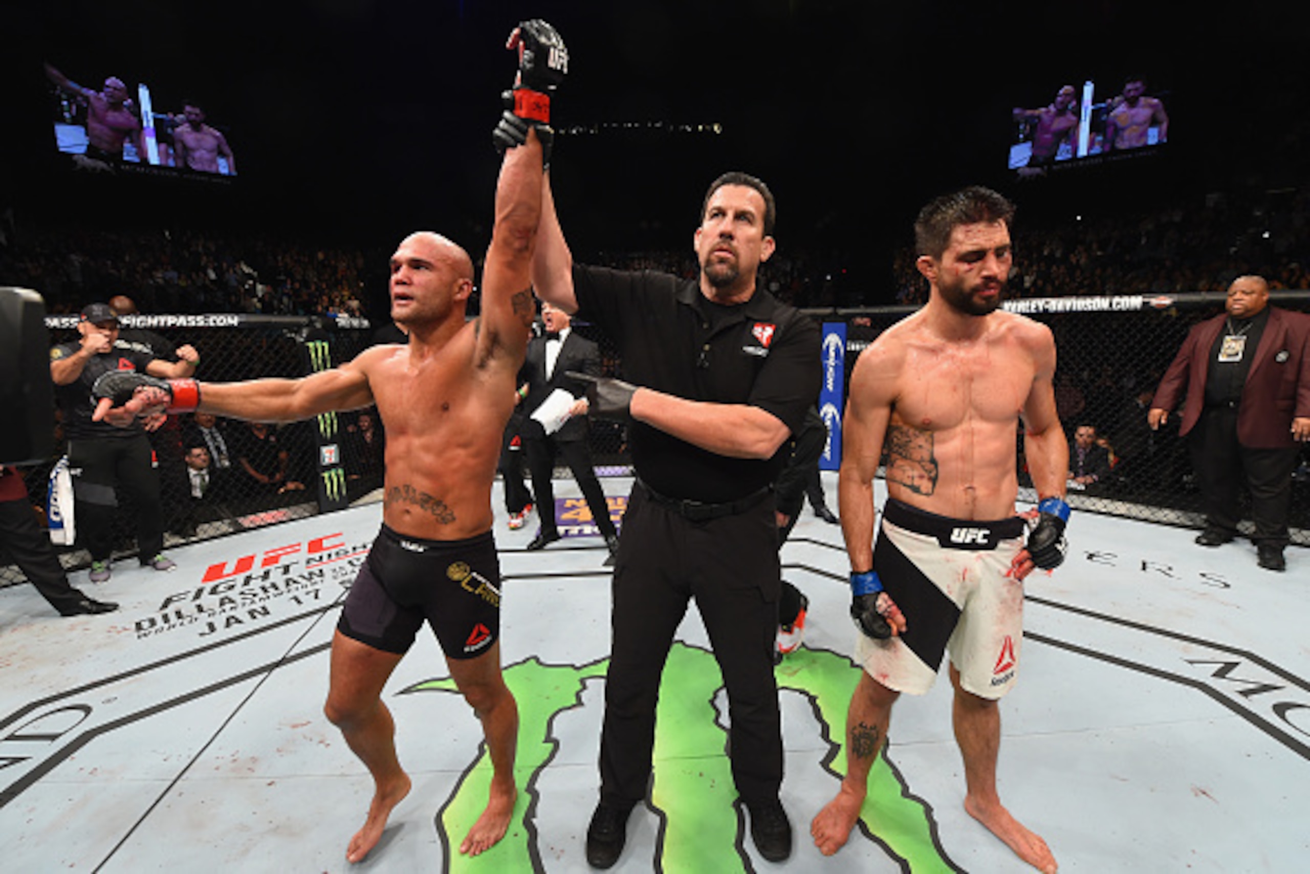 LAS VEGAS, NV - JANUARY 02: Robbie Lawler (left) reacts to his victory over Carlos Condit (right) in their UFC welterweight championship bout during the UFC 195 event inside MGM Grand Garden Arena on January 2, 2016 in Las Vegas, Nevada. (Photo by Josh H LAS VEGAS, NV - JANUARY 02: Robbie Lawler (left) reacts to his victory over Carlos Condit (right) in their UFC welterweight championship bout during the UFC 195 event inside MGM Grand Garden Arena on January 2, 2016 in Las Vegas, Nevada. (Photo by Josh H