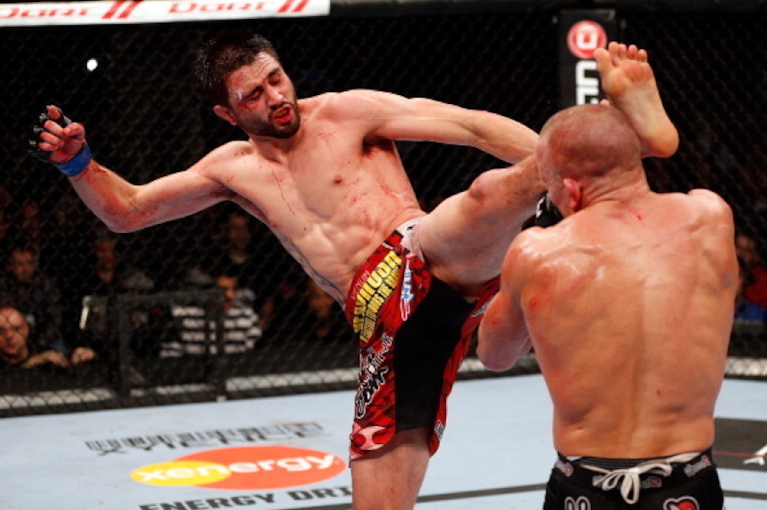 MONTREAL, QC - NOVEMBER 17: Carlos Condit lands a left footed kick to the head of Georges St-Pierre in their welterweight title bout during UFC 154 on November 17, 2012 at the Bell Centre in Montreal, Canada. (Photo by Josh Hedges/Zuffa LLC/Zuffa LLC v MONTREAL, QC - NOVEMBER 17: Carlos Condit lands a left footed kick to the head of Georges St-Pierre in their welterweight title bout during UFC 154 on November 17, 2012 at the Bell Centre in Montreal, Canada. (Photo by Josh Hedges/Zuffa LLC/Zuffa LLC v