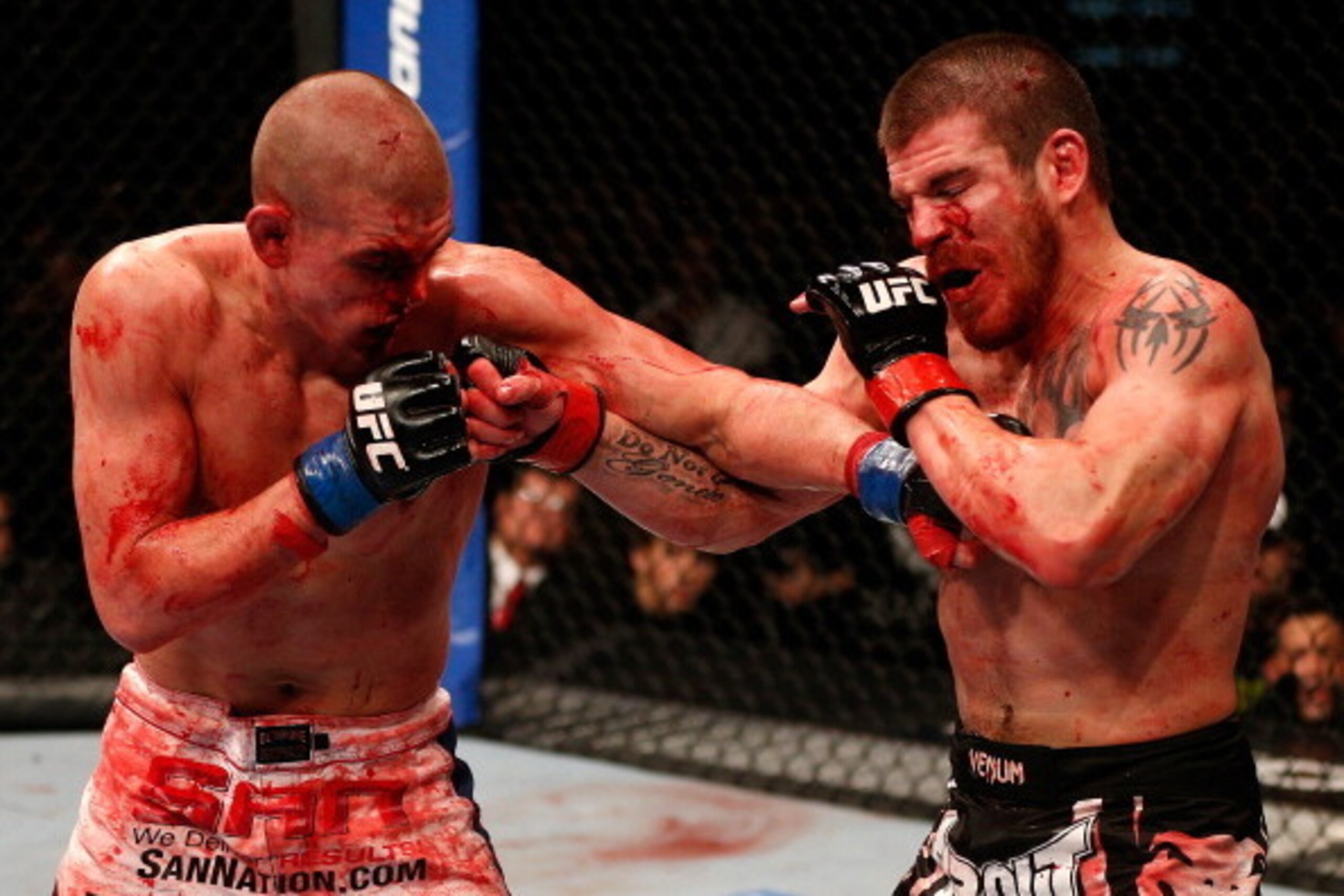 LAS VEGAS, NV - DECEMBER 29: (L-R) Joe Lauzon and Jim Miller trade punches during their lightweight fight at UFC 155 on December 29, 2012 at MGM Grand Garden Arena in Las Vegas, Nevada. (Photo by Josh Hedges/Zuffa LLC/Zuffa LLC via Getty Images)