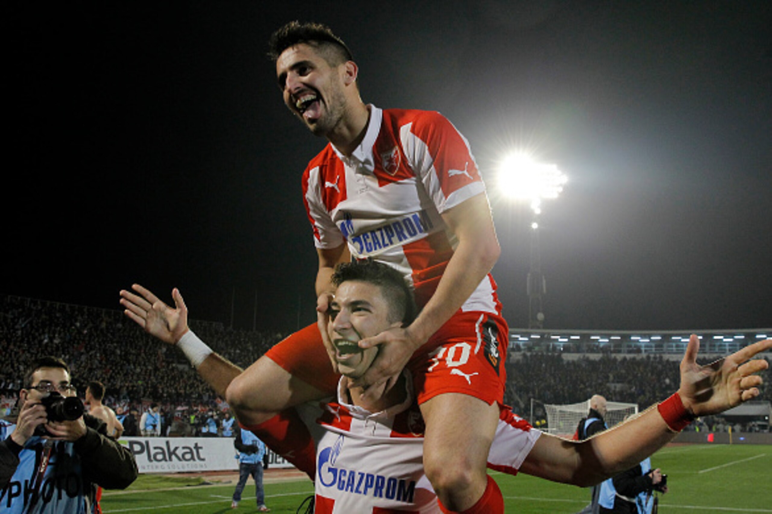 BELGRADE, SERBIA - FEBRUARY 27 : Hugo Oliveira Vieira (TOP) and Marko Grujic (DOWN) of FK Crvena Zvezda celebrate victory after the Serbian Super League match between FK Partizan and FK Crvena Zvezda at Stadium FK Partizan on February 27, 2016 in Belgrade