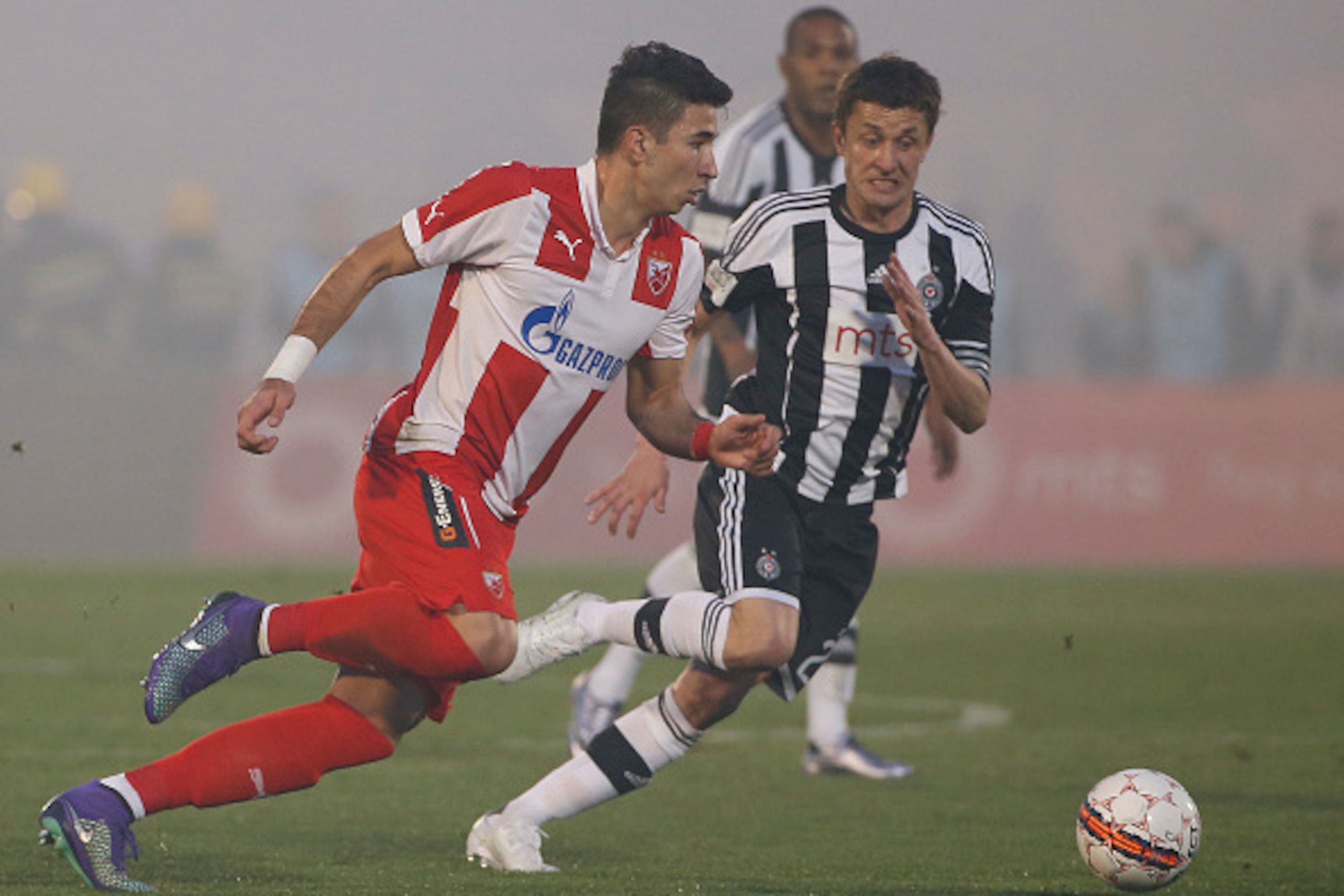 BELGRADE, SERBIA - FEBRUARY 27 : Marko Grujic (L) of FK Crvena Zvezda in action against Sasa Ilic (R) of FK Partizan during the Serbian Super League match between FK Partizan and FK Crvena Zvezda at Stadium FK Partizan on February 27, 2016 in Belgrade, Se