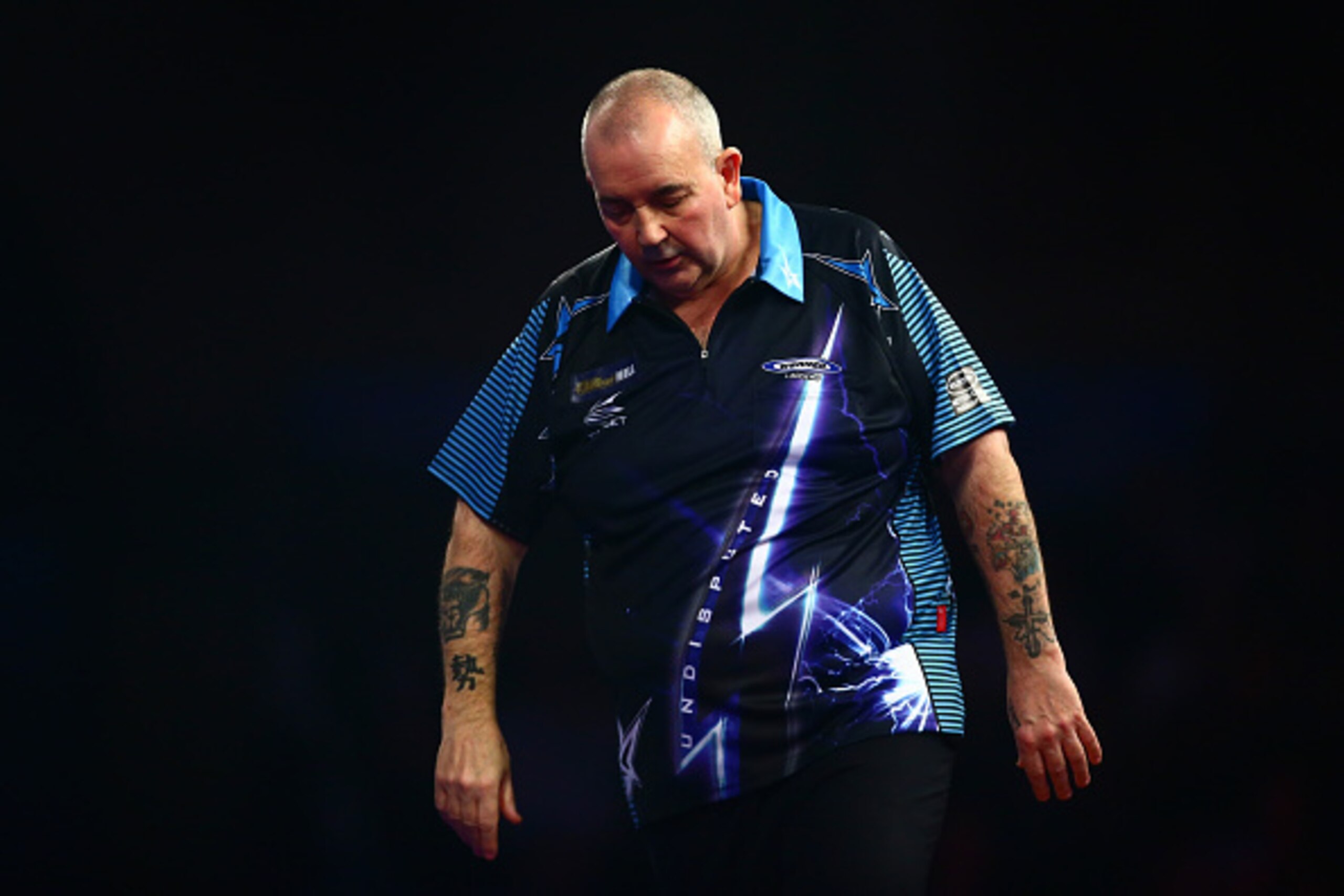 LONDON, ENGLAND - DECEMBER 30:  Phil Taylor of England looks dejected in his third round match against Jelle Klaasen of the Netherlands on Day Twelve of the 2016 William Hill PDC World Darts Championships at Alexandra Palace on December 30, 2015 in London