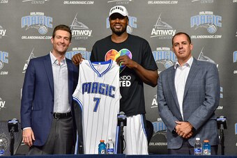 ORLANDO, FL - JUNE 30:  Orlando Magic general manager Rob Hennigan and head coach Frank Vogel introduce new Magic player Serge Ibaka during a press conference on June 30, 2016 at Amway Center in Orlando, Florida. NOTE TO USER: User expressly acknowledges 