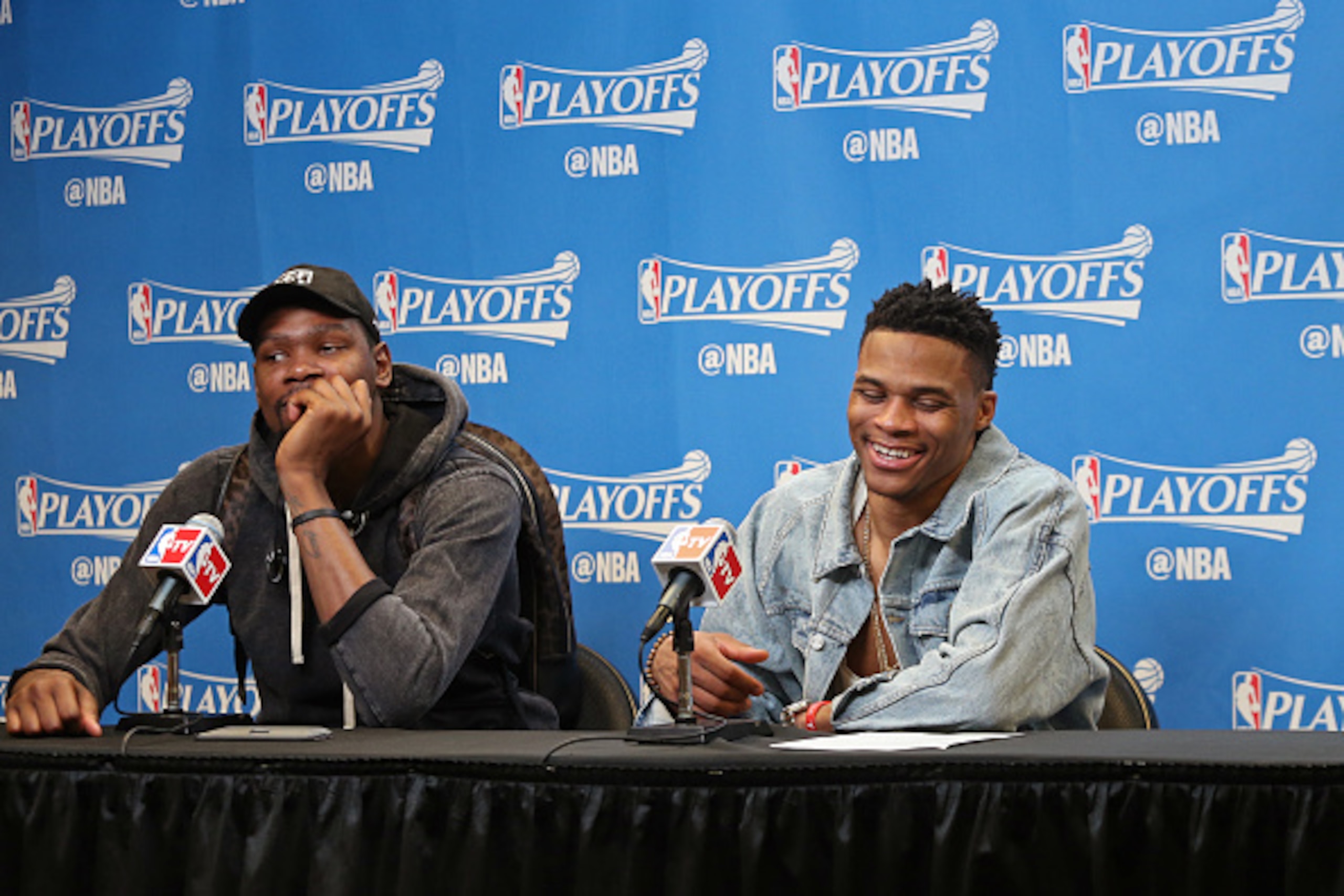 SAN ANTONIO, TX - MAY 10:  Kevin Durant #35 and Russell Westbrook #0 of the Oklahoma City Thunder speak at a press conference after Game Five of the Western Conference Semifinals against the San Antonio Spurs during the 2016 NBA Playoffs on May 10, 2016 a