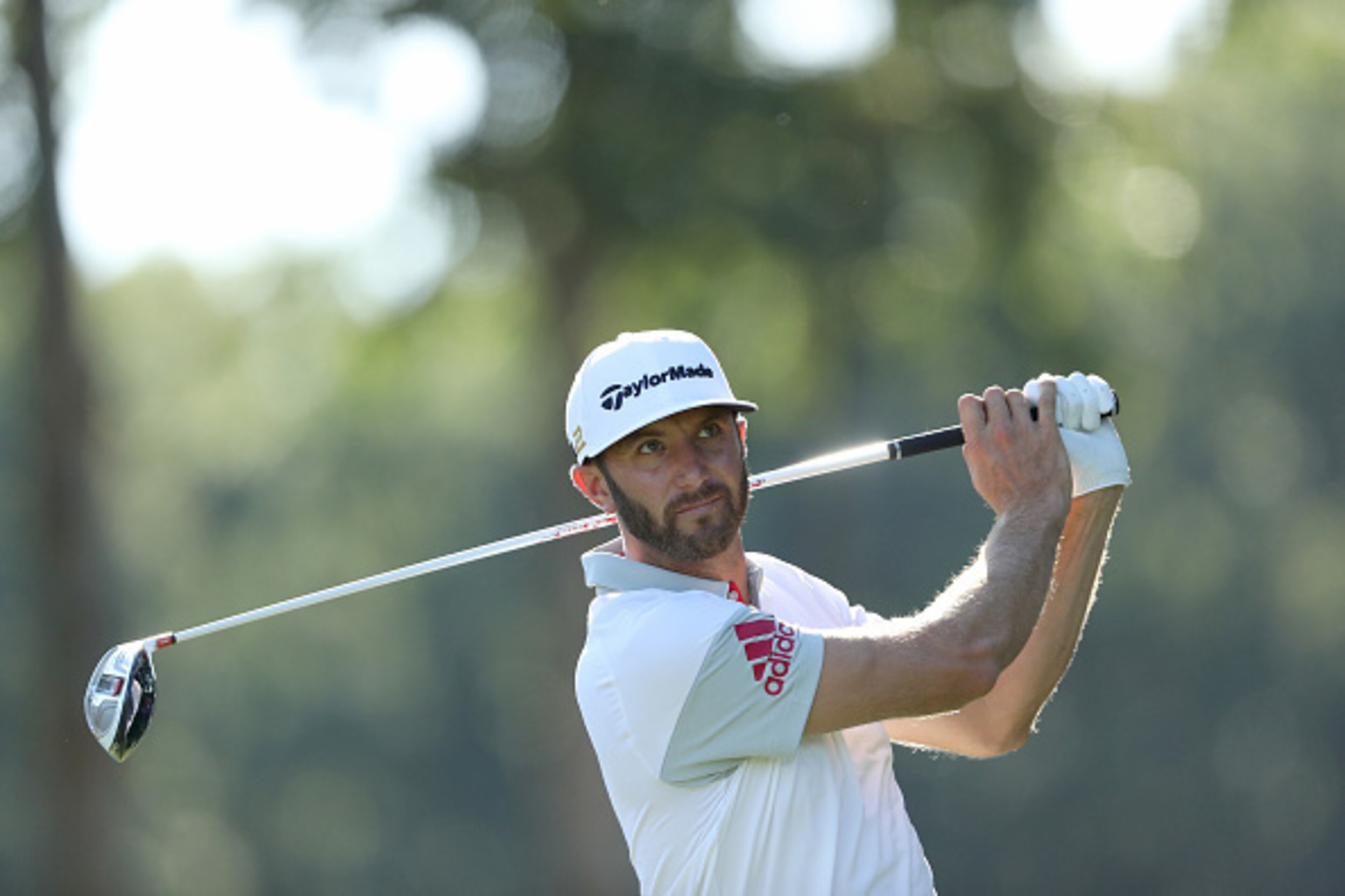 FARMINGDALE, NY - AUGUST 25:  Dustin Johnson of the United States plays his tee shot on the 12th hole during the first round of The Barclays in the PGA Tour FedExCup Play-Offs on the Black Course at Bethpage State Park on August 25, 2016 in Farmongdale, N