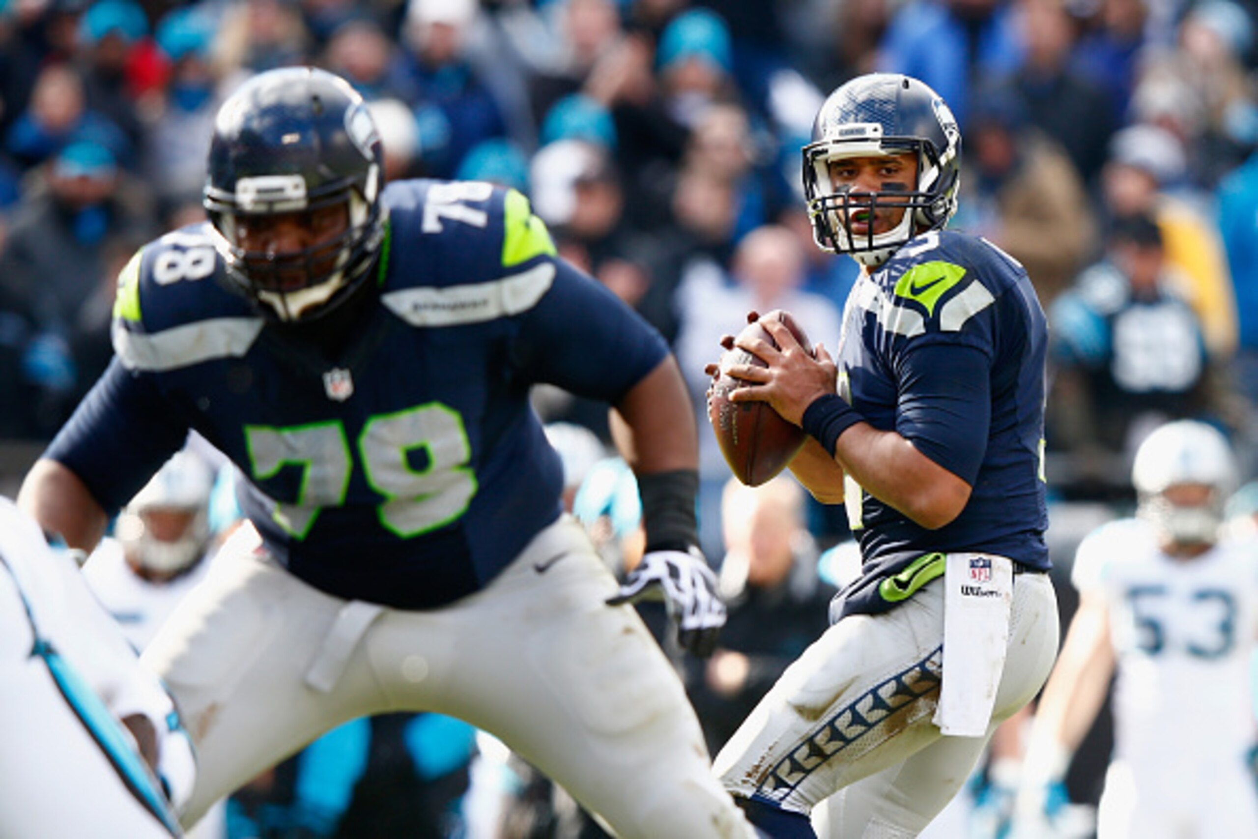 CHARLOTTE, NC - JANUARY 17:  Russell Wilson #3 of the Seattle Seahawks looks to attempt a pass during the NFC Divisional Playoff Game against the Carolina Panthers at Bank of America Stadium on January 17, 2016 in Charlotte, North Carolina.  (Photo by Jam
