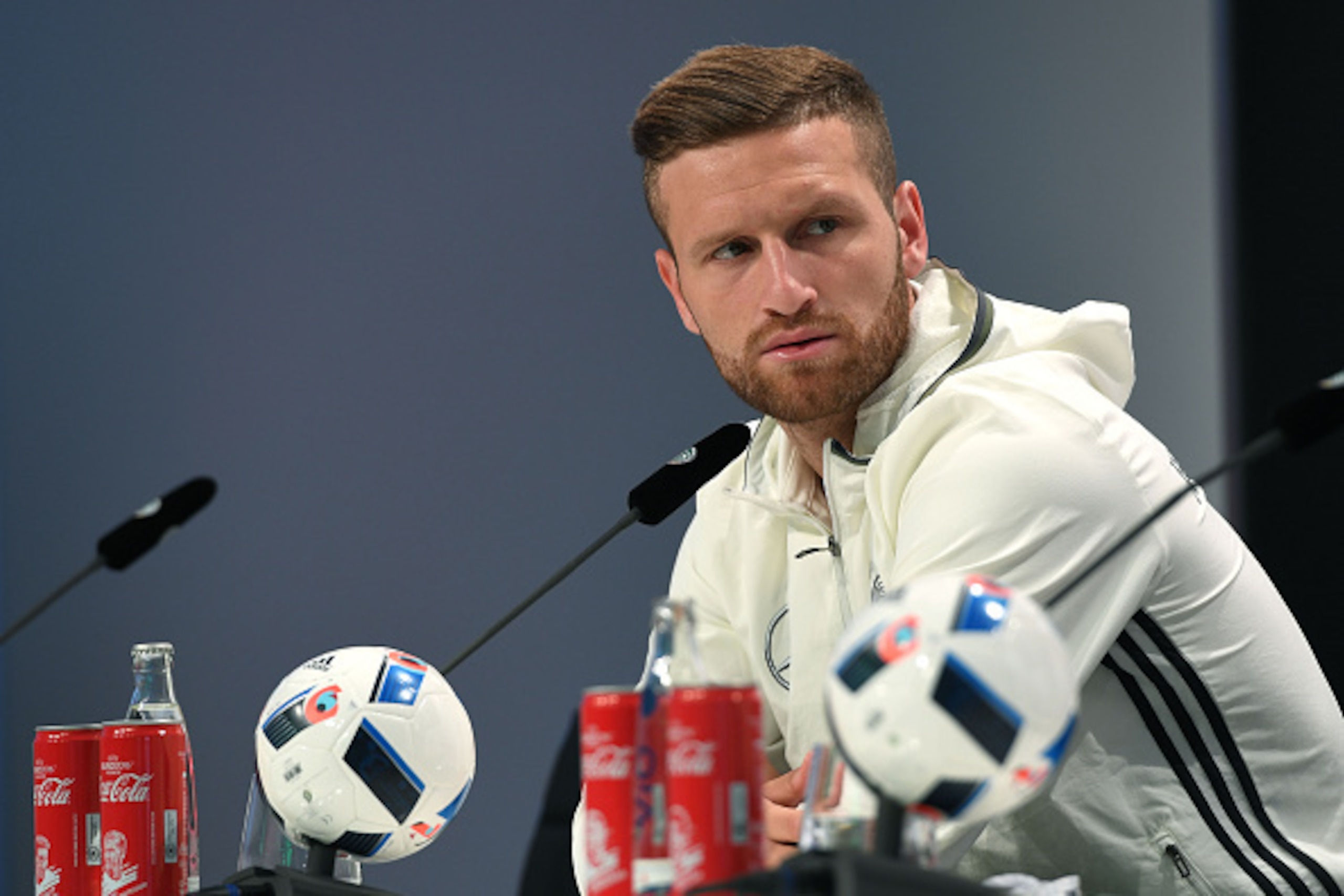 Germany's midfielder Skodran Mustafi holds a press conference in Evian on June 14, 2016 during the Euro 2016 football tournament. / AFP / PATRIK STOLLARZ        (Photo credit should read PATRIK STOLLARZ/AFP/Getty Images)