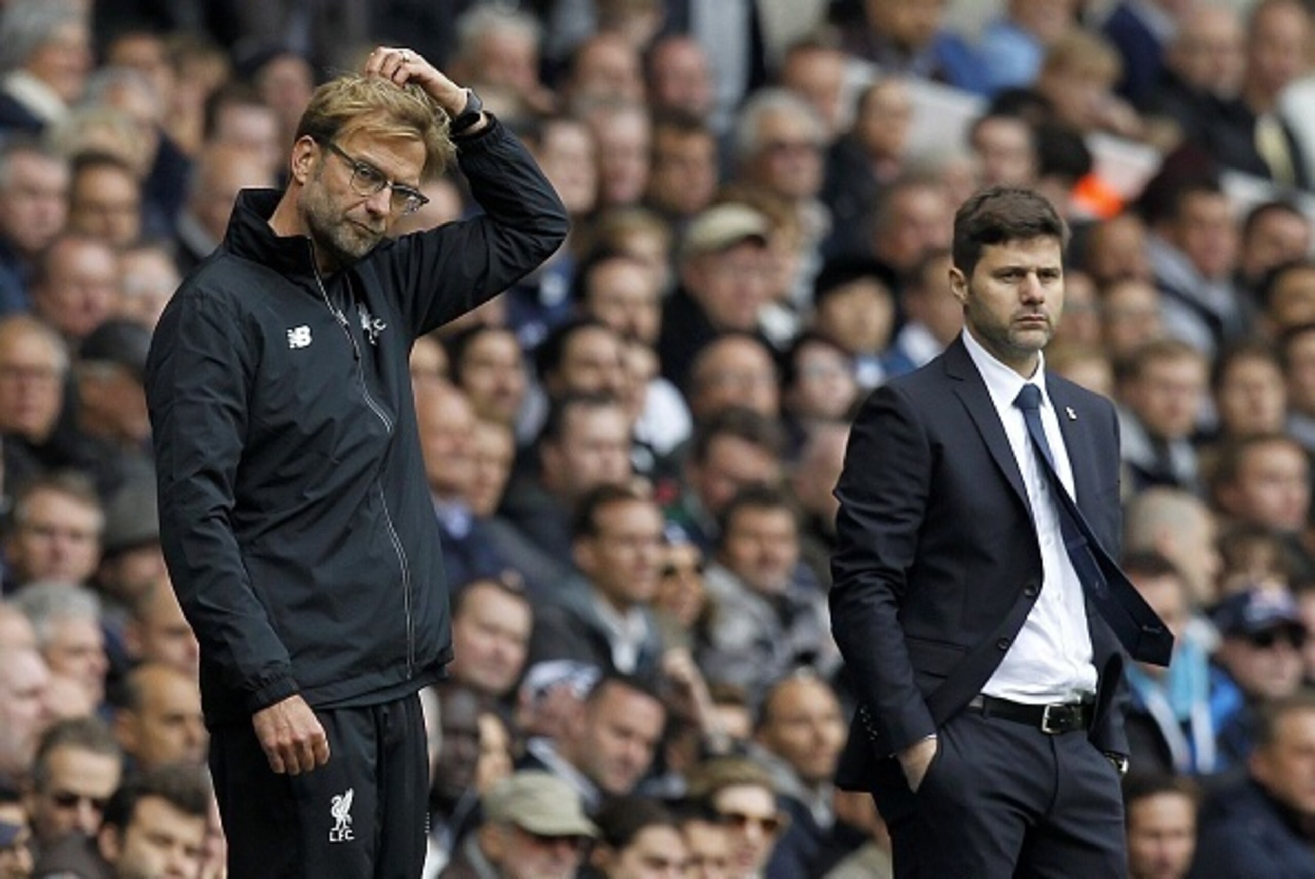 Tottenham Hotspur's Argentinian Head Coach Mauricio Pochettino (R) looks on as Liverpool's German manager Jurgen Klopp (L) gestures during the English Premier League football match between Tottenham Hotspur and Liverpool at White Hart Lane in north London Tottenham Hotspur's Argentinian Head Coach Mauricio Pochettino (R) looks on as Liverpool's German manager Jurgen Klopp (L) gestures during the English Premier League football match between Tottenham Hotspur and Liverpool at White Hart Lane in north London