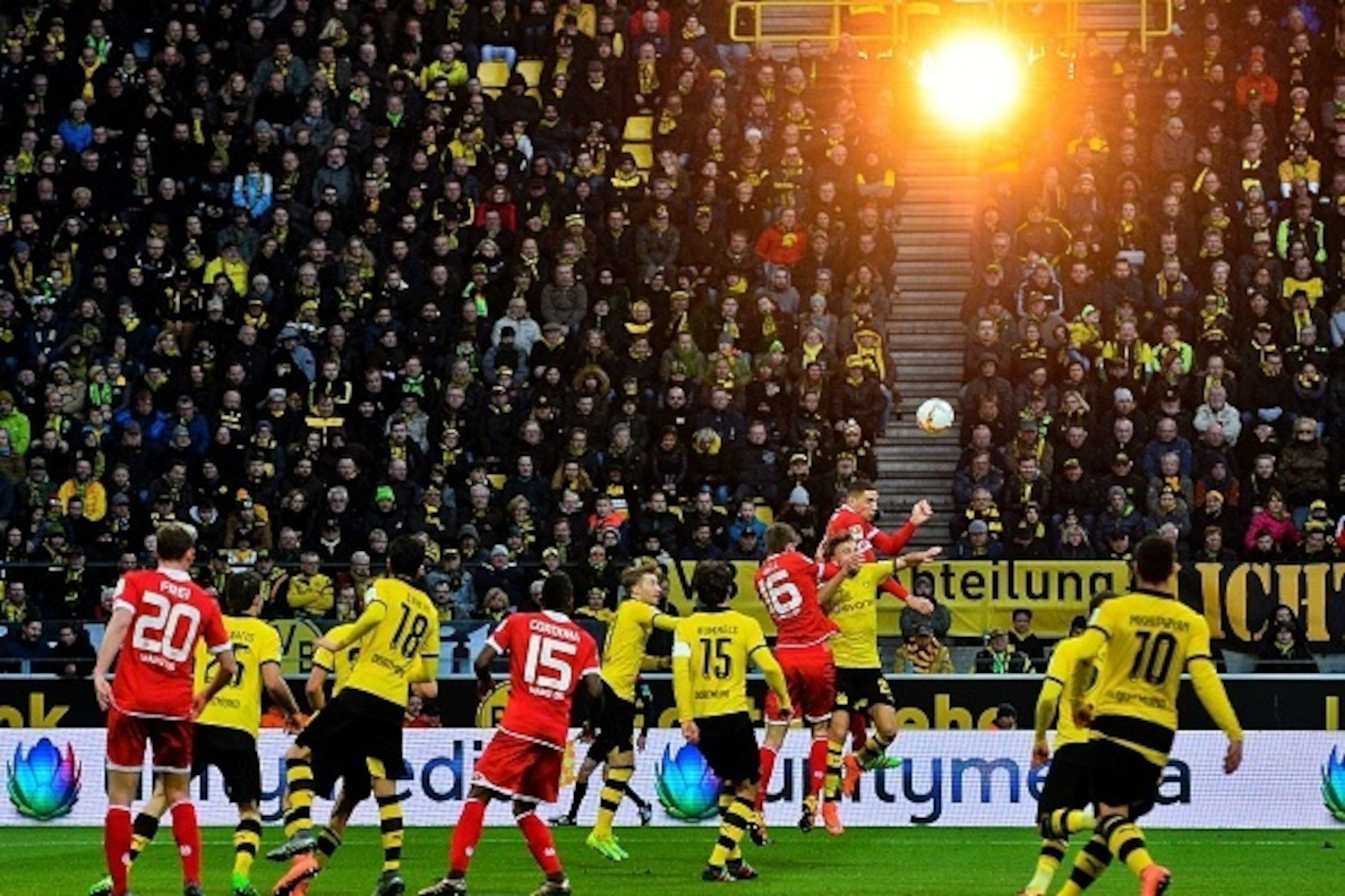 Dortmund's Marcel Schmelzer and Mainz's Stefan Bell vie during the German first division Bundesliga football match Borussia Dortmund v 1 FSV Mainz 05 in Dortmund, on March 13, 2016. / AFP / SASCHA SCHUERMANN / RESTRICTIONS: DURING MATCH TIME: DFL RULES TO