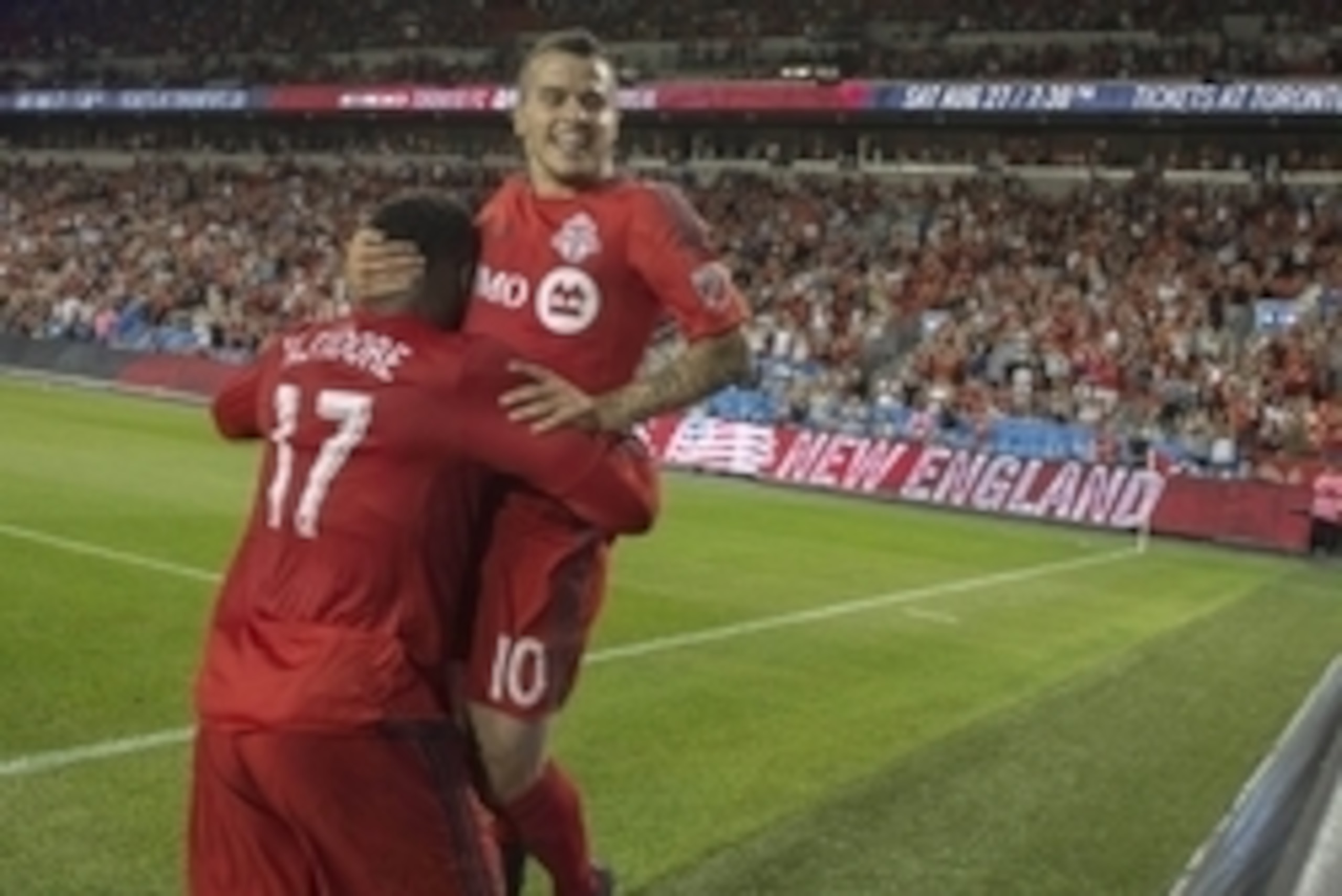 Aug 6, 2016; Toronto, Ontario, CAN; Toronto FC forward Jozy Altidore (17) celebrates with Toronto FC forward Sebastian Giovinco (10) after scoring a goal during the second half in a game against the New England Revolution at BMO Field. Toronto FC won 4-1.