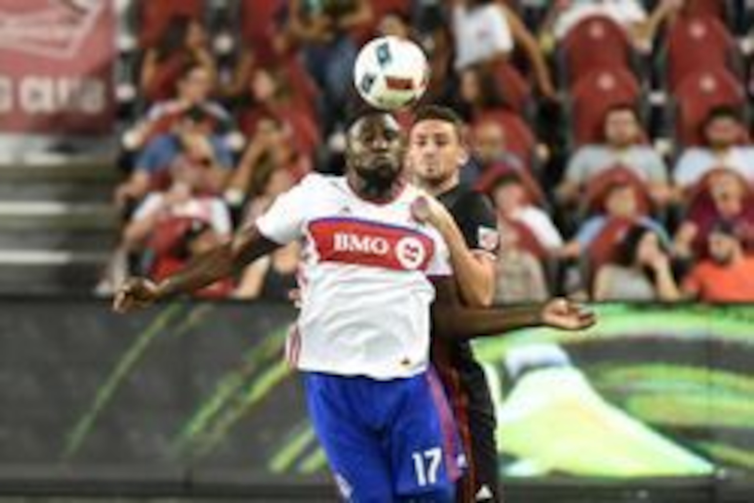 Jul 23, 2016; Toronto, Ontario, CAN; Toronto FC forward Jozy Altidore (17) heads the ball down in front of DC United defender Steven Birnbaum (15) at BMO Field. Mandatory Credit: Dan Hamilton-USA TODAY Sports