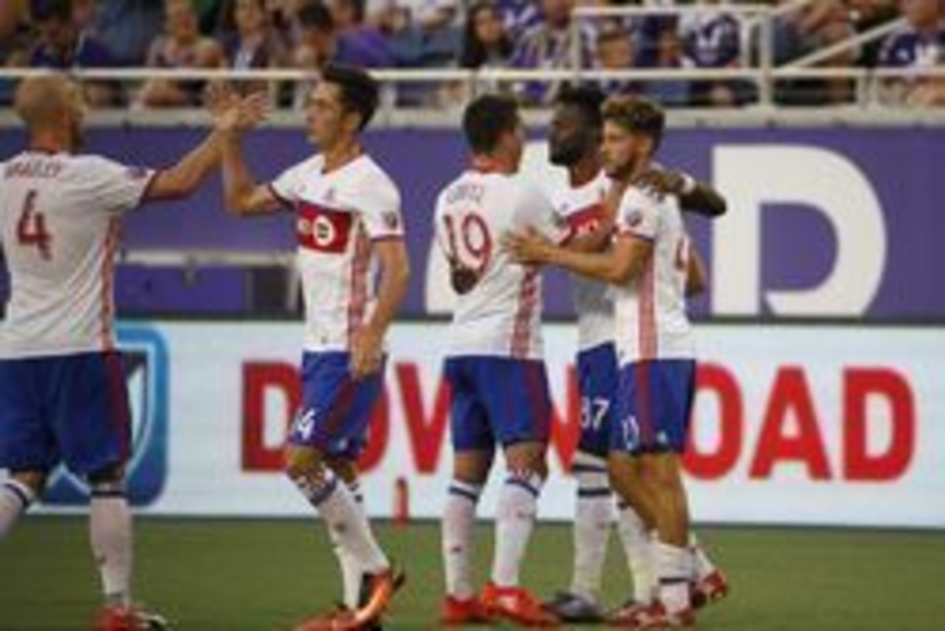 Aug 24, 2016; Orlando, FL, USA; Toronto FC forward Tossing Ricketts (87) celebrates with teammates after scoring a goal against the Orlando City SC during the first half at Camping World Stadium. Mandatory Credit: Kim Klement-USA TODAY Sports