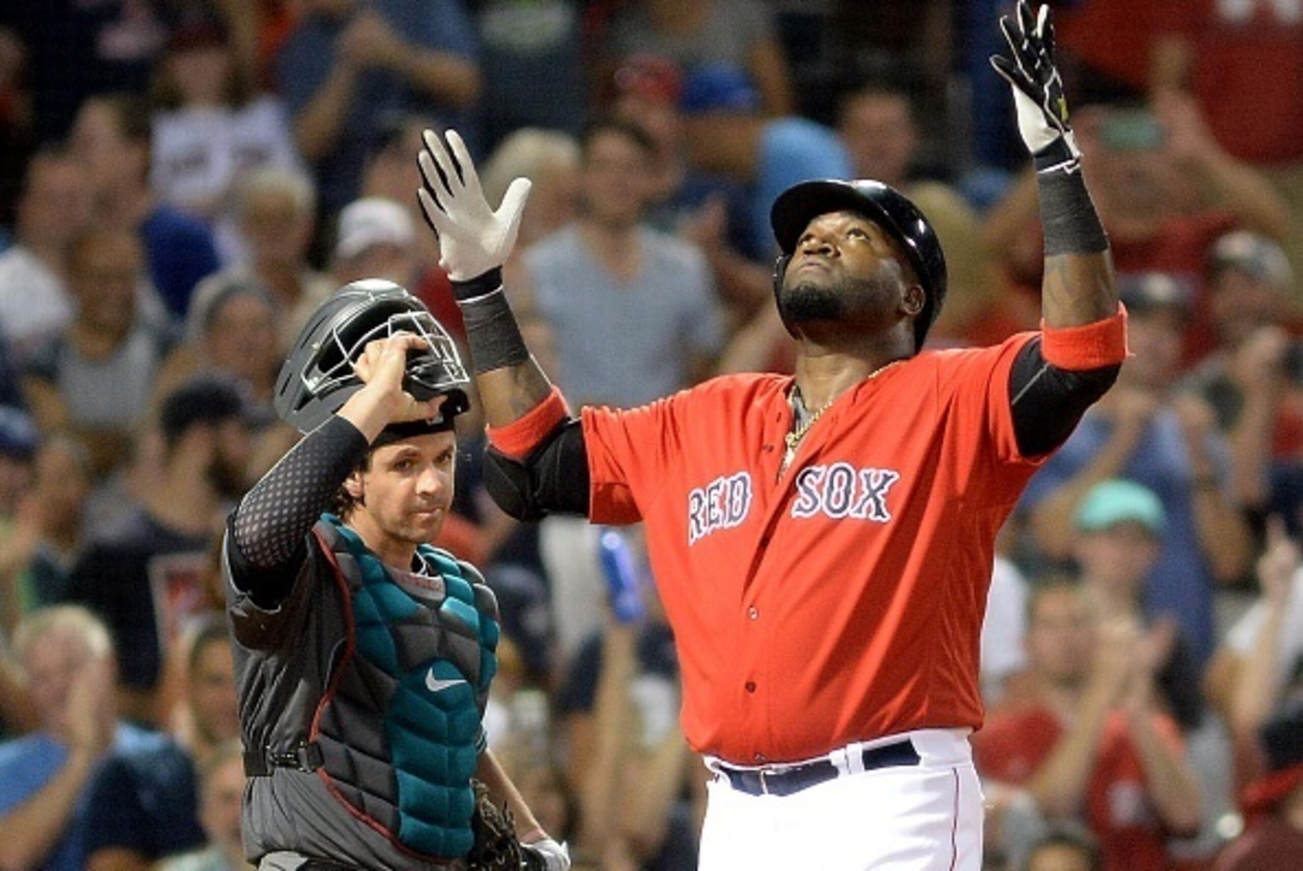 BOSTON, MA - AUGUST 12: David Ortiz #34 of the Boston Red Sox reacts after hitting a home run in the seventh inning as Tuffy Gosewisch #8 of the Arizona Diamondbacks looks on at Fenway Park on August 12, 2016 in Boston, Massachusetts. (Photo by Darren McC