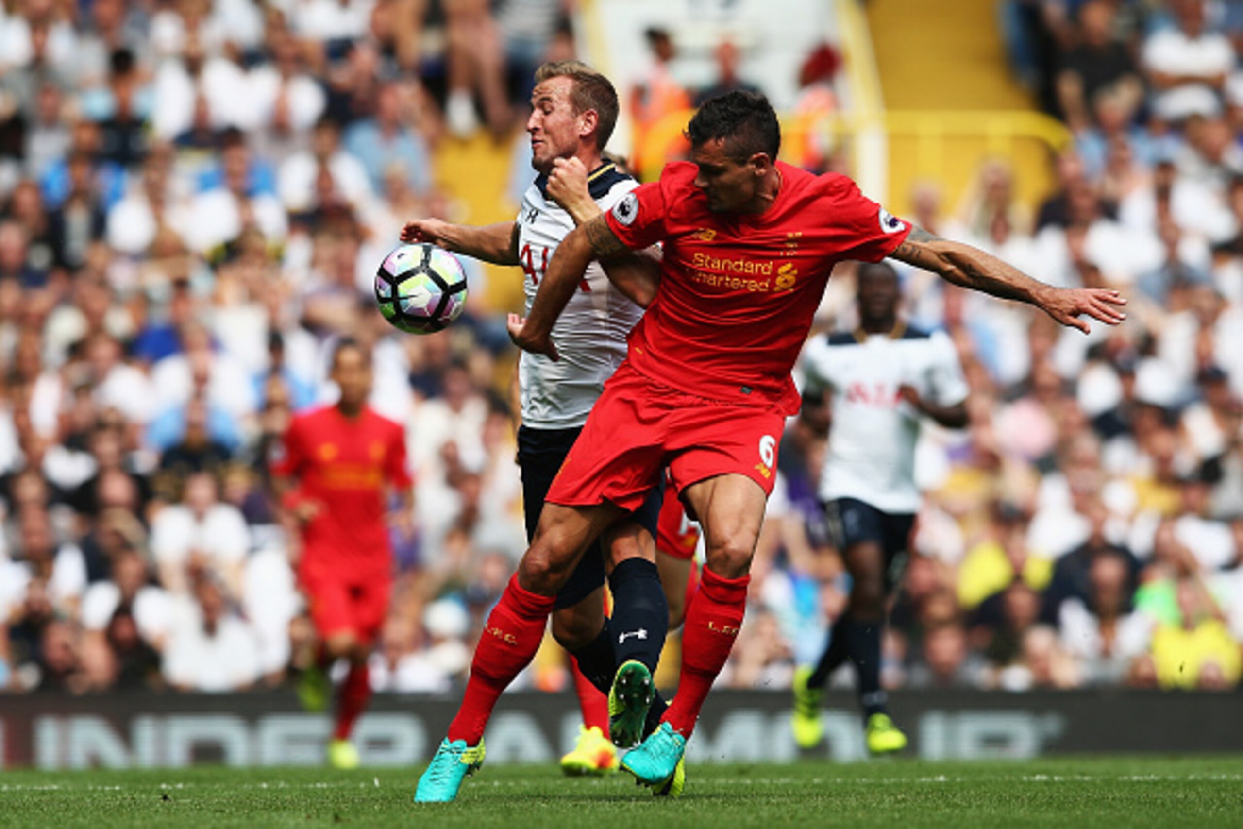 LONDON, ENGLAND - AUGUST 27:  Harry Kane of Tottenham Hotspur (L) and Dejan Lovren of Liverpool (R) battle for possession during the Premier League match between Tottenham Hotspur and Liverpool at White Hart Lane on August 27, 2016 in London, England.  (P