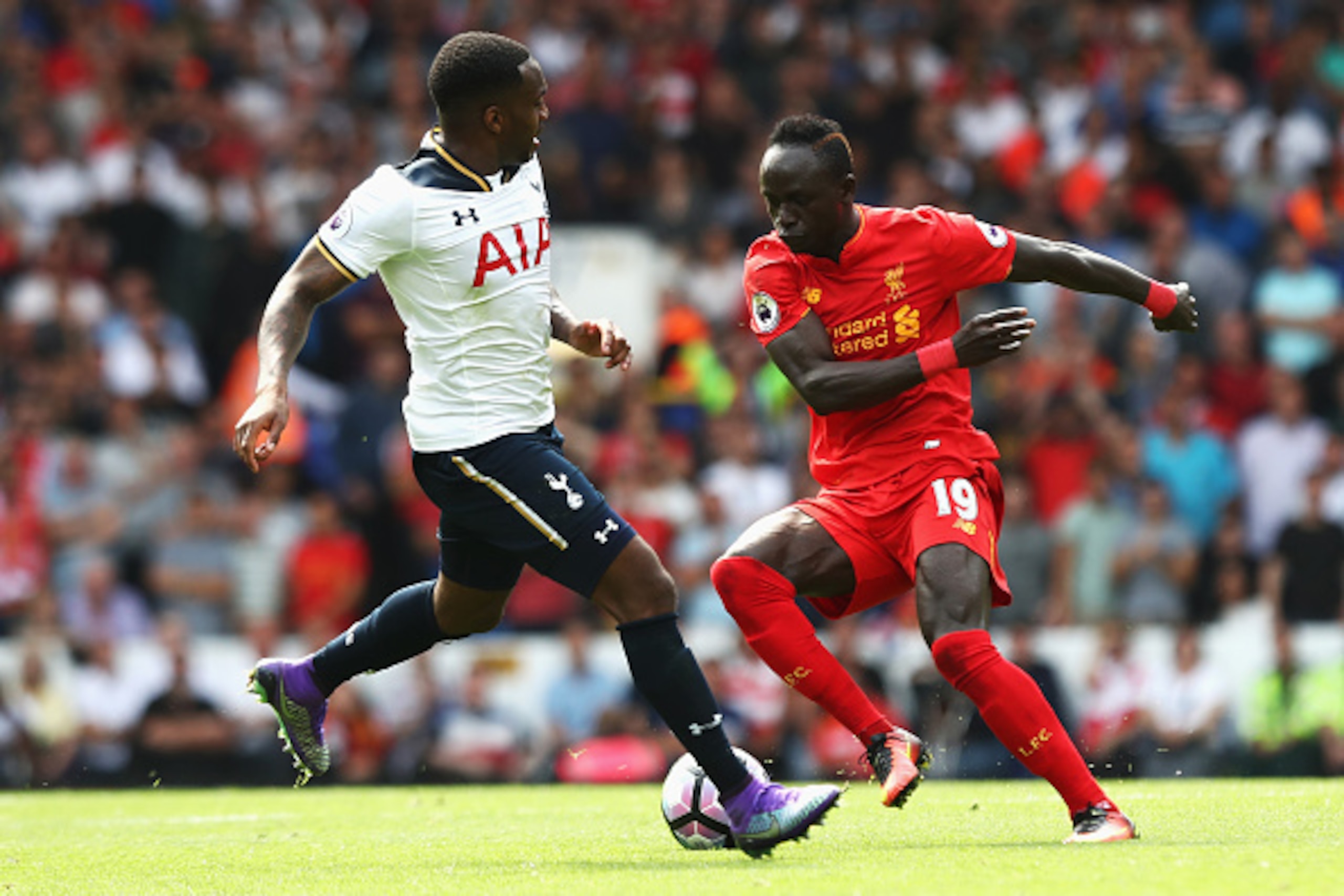 LONDON, ENGLAND - AUGUST 27: (R) Sadio Mane of Liverpool takes the ball past (L) Danny Rose of Tottenham Hotspur during the Premier League match between Tottenham Hotspur and Liverpool at White Hart Lane on August 27, 2016 in London, England.  (Photo by J