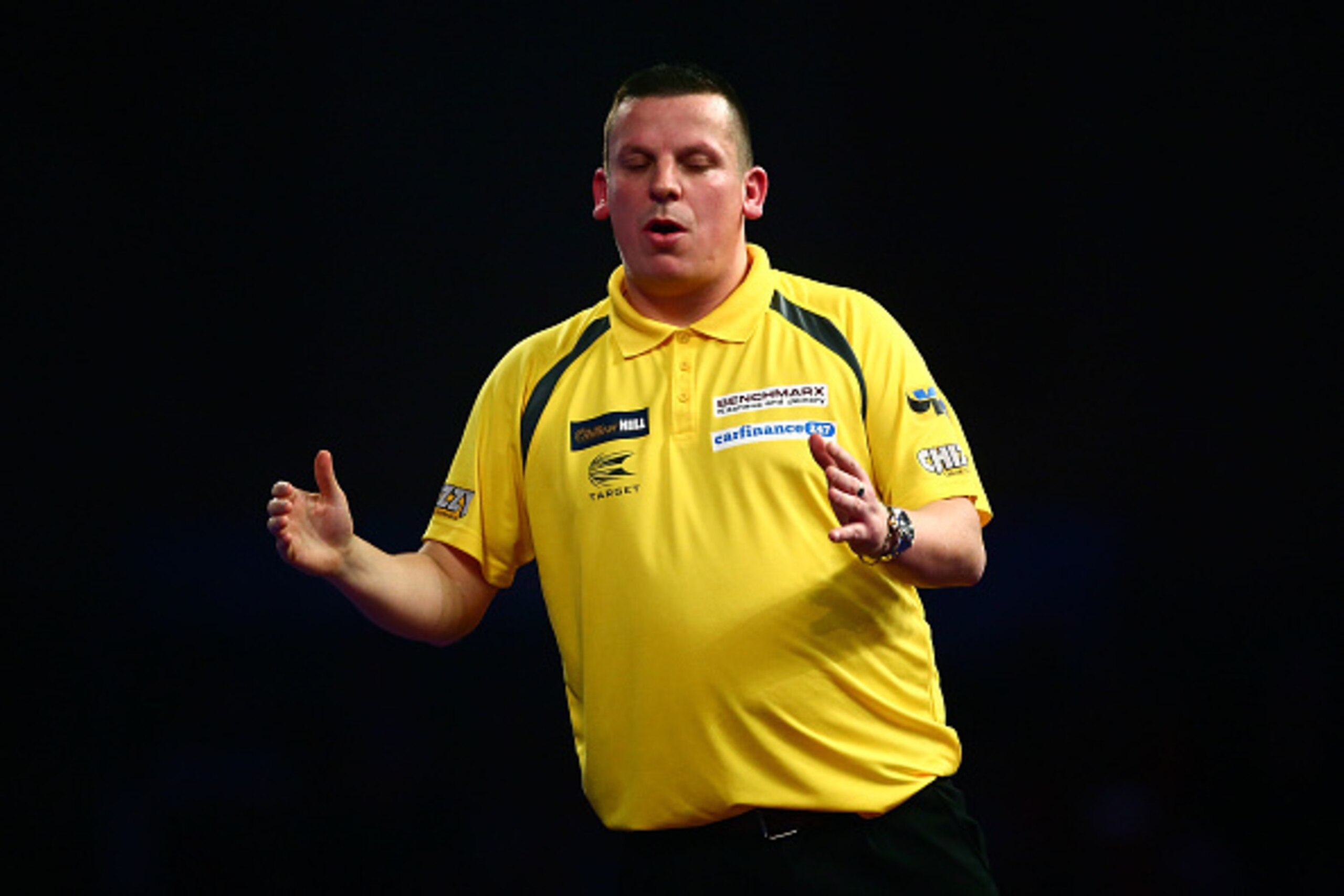 LONDON, ENGLAND - DECEMBER 30:  Dave Chisnall of England reacts in his third round match against Peter Wright of Scotland on Day Twelve of the 2016 William Hill PDC World Darts Championships at Alexandra Palace on December 30, 2015 in London, England.  (P