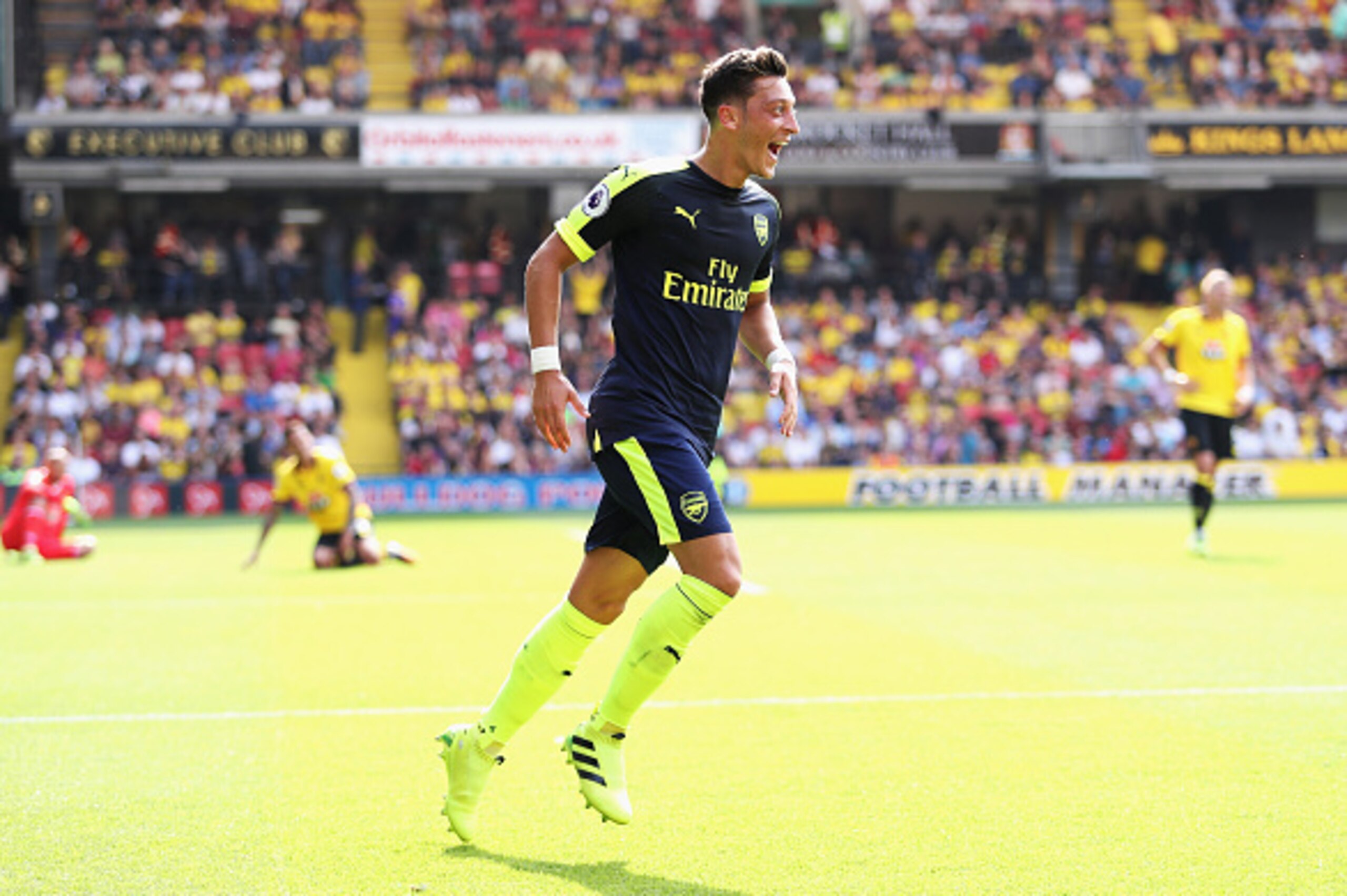 WATFORD, ENGLAND - AUGUST 27: Mesut Ozil of Arsenal scores his sides third goal during the Premier League match between Watford and Arsenal at Vicarage Road on August 27, 2016 in Watford, England.  (Photo by Christopher Lee/Getty Images)