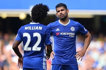 Chelsea's Brazilian midfielder Willian (L) talks with Chelsea's Brazilian-born Spanish striker Diego Costa during the English Premier League football match between Chelsea and Burnley at Stamford Bridge in London on August 27, 2016. / AFP / GLYN KIRK / RE