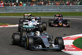 SPA, BELGIUM - AUGUST 28: Lewis Hamilton of Great Britain driving the (44) Mercedes AMG Petronas F1 Team Mercedes F1 WO7 Mercedes PU106C Hybrid turbo leads Felipe Massa of Brazil driving the (19) Williams Martini Racing Williams FW38 Mercedes PU106C Hybri