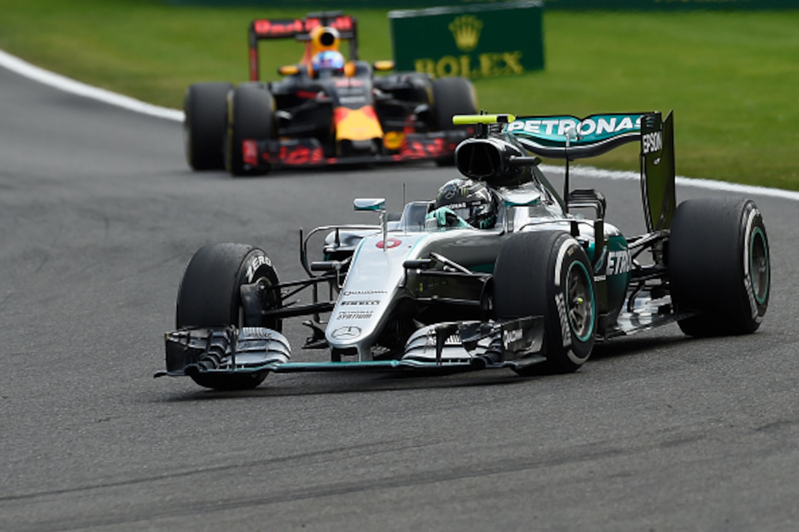 Mercedes AMG Petronas F1 Team's German driver Nico Rosberg drives ahead of Red Bull Racing's Australian driver Daniel Ricciardo during the Belgian Formula One Grand Prix at the Spa-Francorchamps circuit in Spa on August 28, 2016.  / AFP / JOHN THYS       
