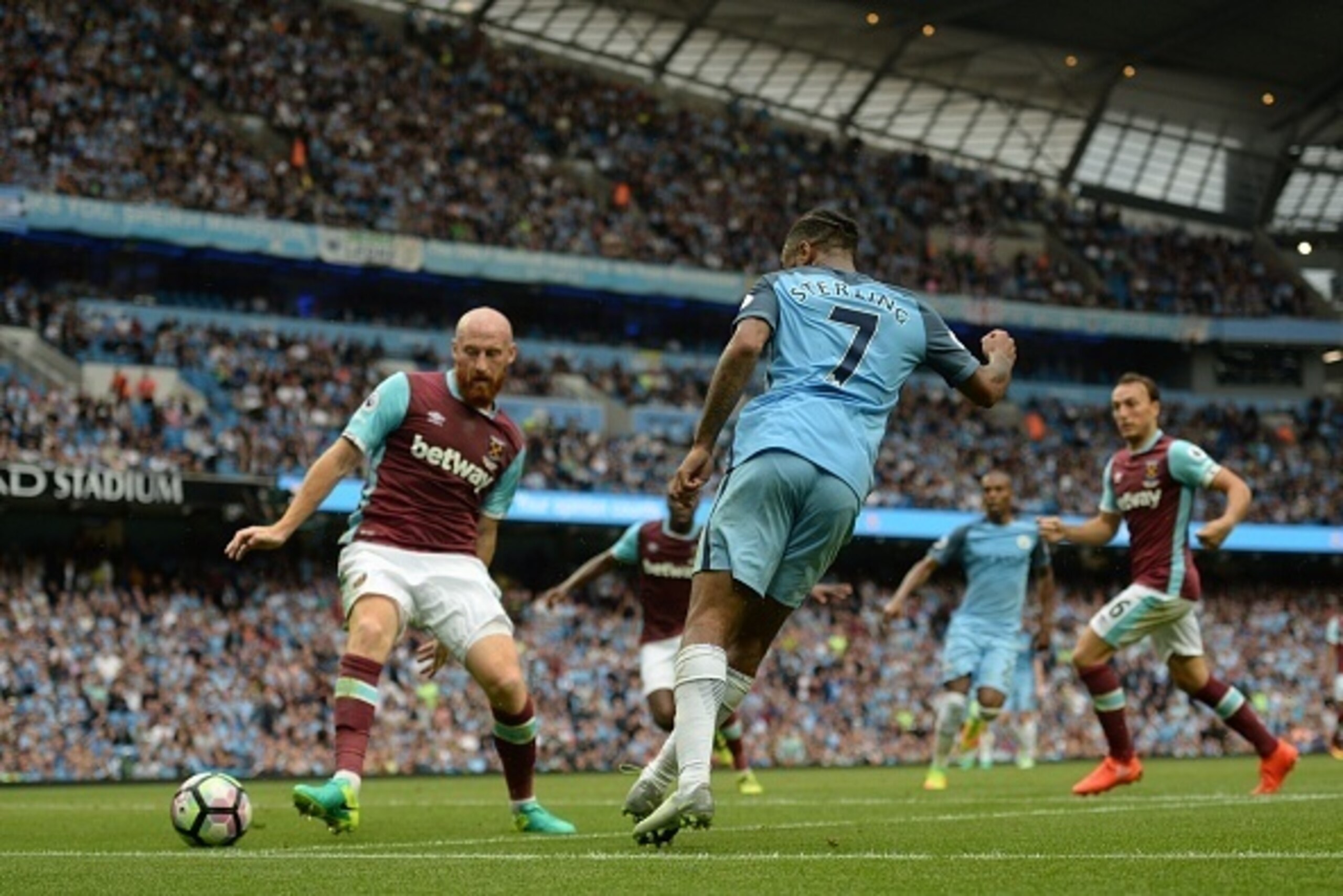 Manchester City's English midfielder Raheem Sterling scores his second goal during the English Premier League football match between Manchester City and West Ham United at the Etihad Stadium in Manchester, north west England, on August 28, 2016.
Mancheste