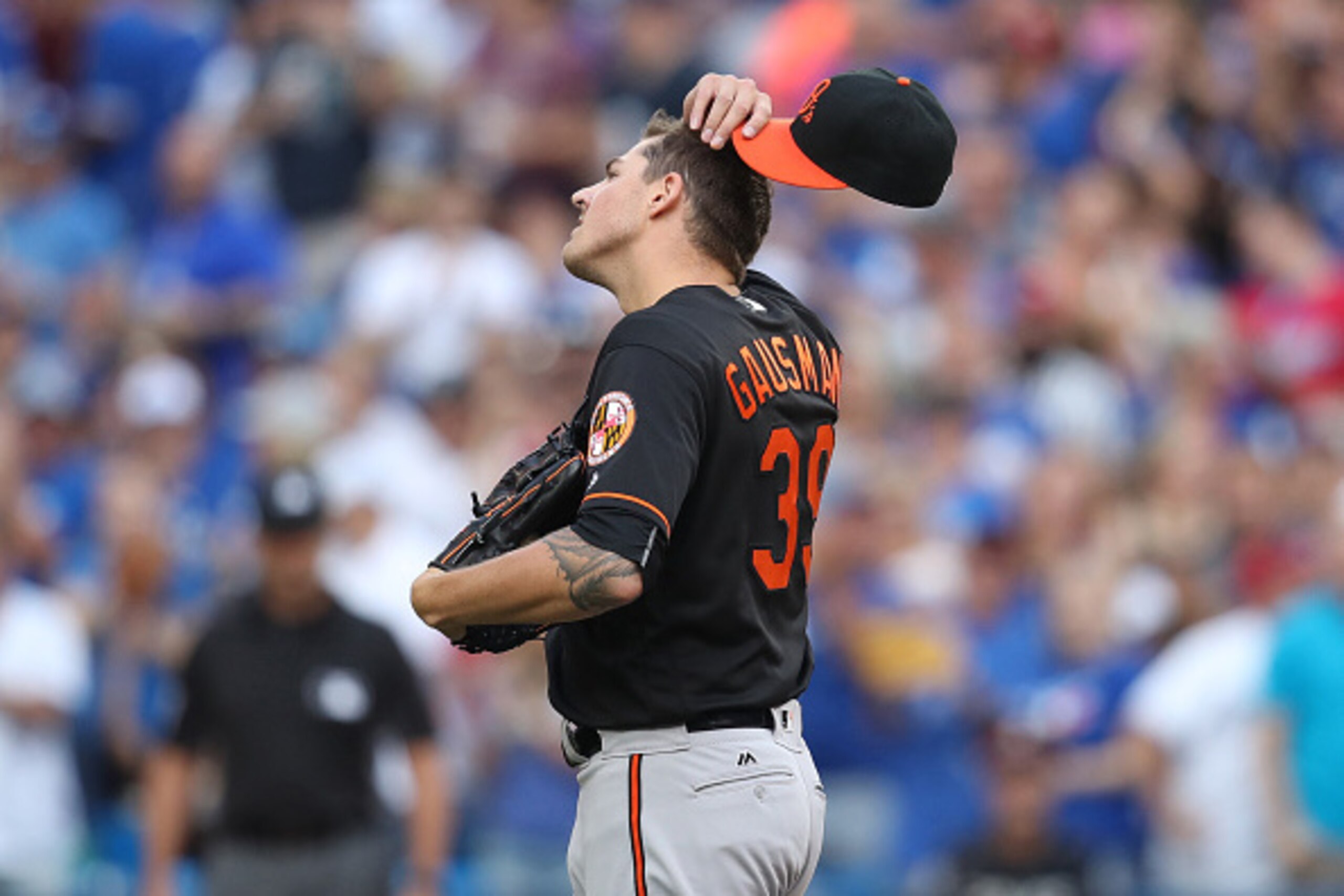 TORONTO, CANADA - JULY 29: Kevin Gausman #39 of the Baltimore Orioles reacts after giving up a solo home run to Edwin Encarnacion #10 of the Toronto Blue Jays in the first inning during MLB game action on July 29, 2016 at Rogers Centre in Toronto, Ontario