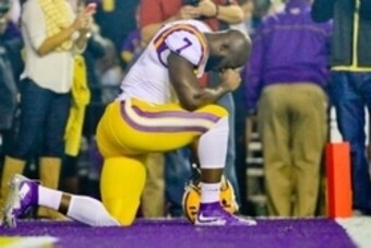 Nov 14, 2015; Baton Rouge, LA, USA; LSU Tigers running back Leonard Fournette (7) kneels to pray before a game against the Arkansas Razorbacks at Tiger Stadium. Mandatory Credit: Derick E. Hingle-USA TODAY Sports