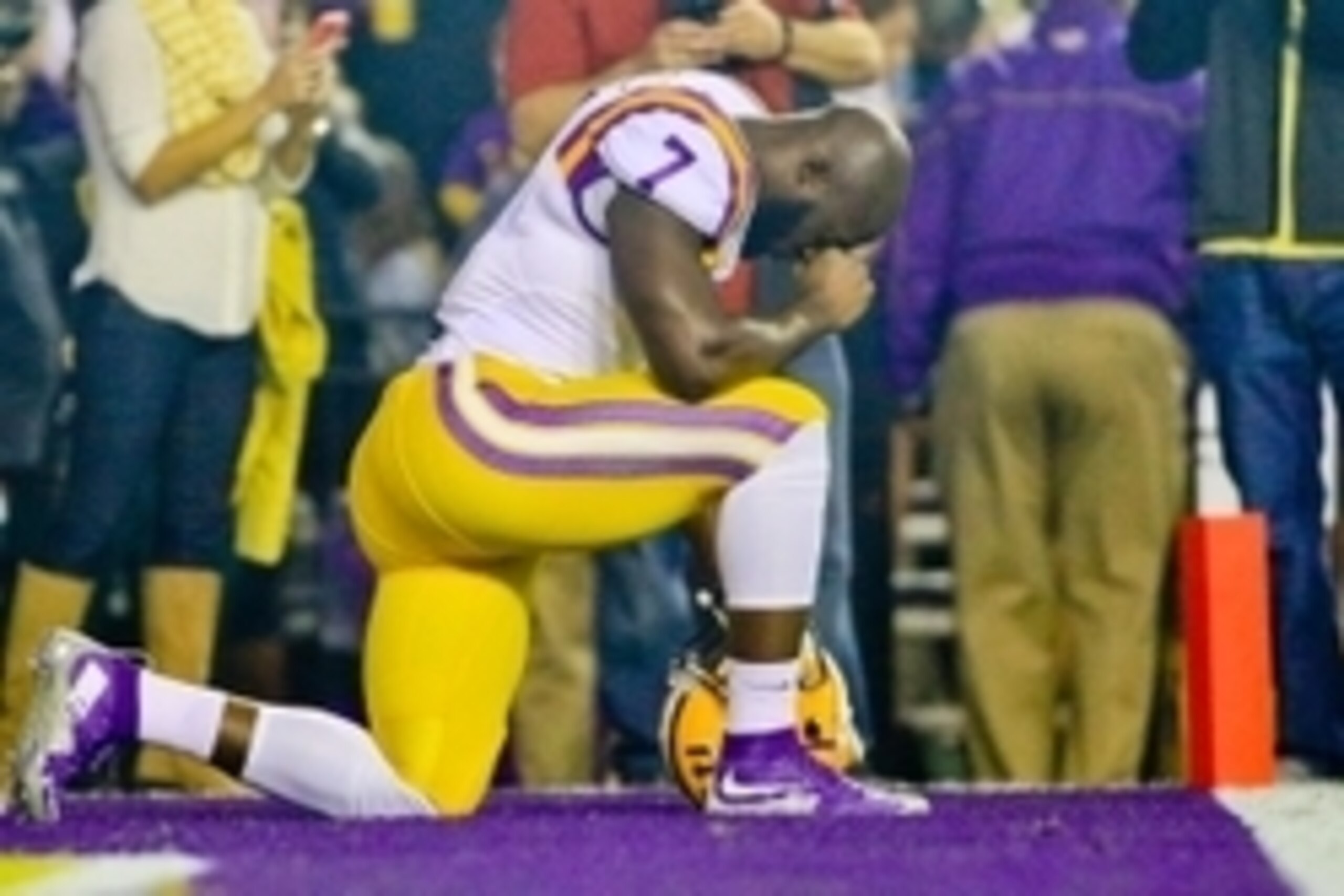 Nov 14, 2015; Baton Rouge, LA, USA; LSU Tigers running back Leonard Fournette (7) kneels to pray before a game against the Arkansas Razorbacks at Tiger Stadium. Mandatory Credit: Derick E. Hingle-USA TODAY Sports