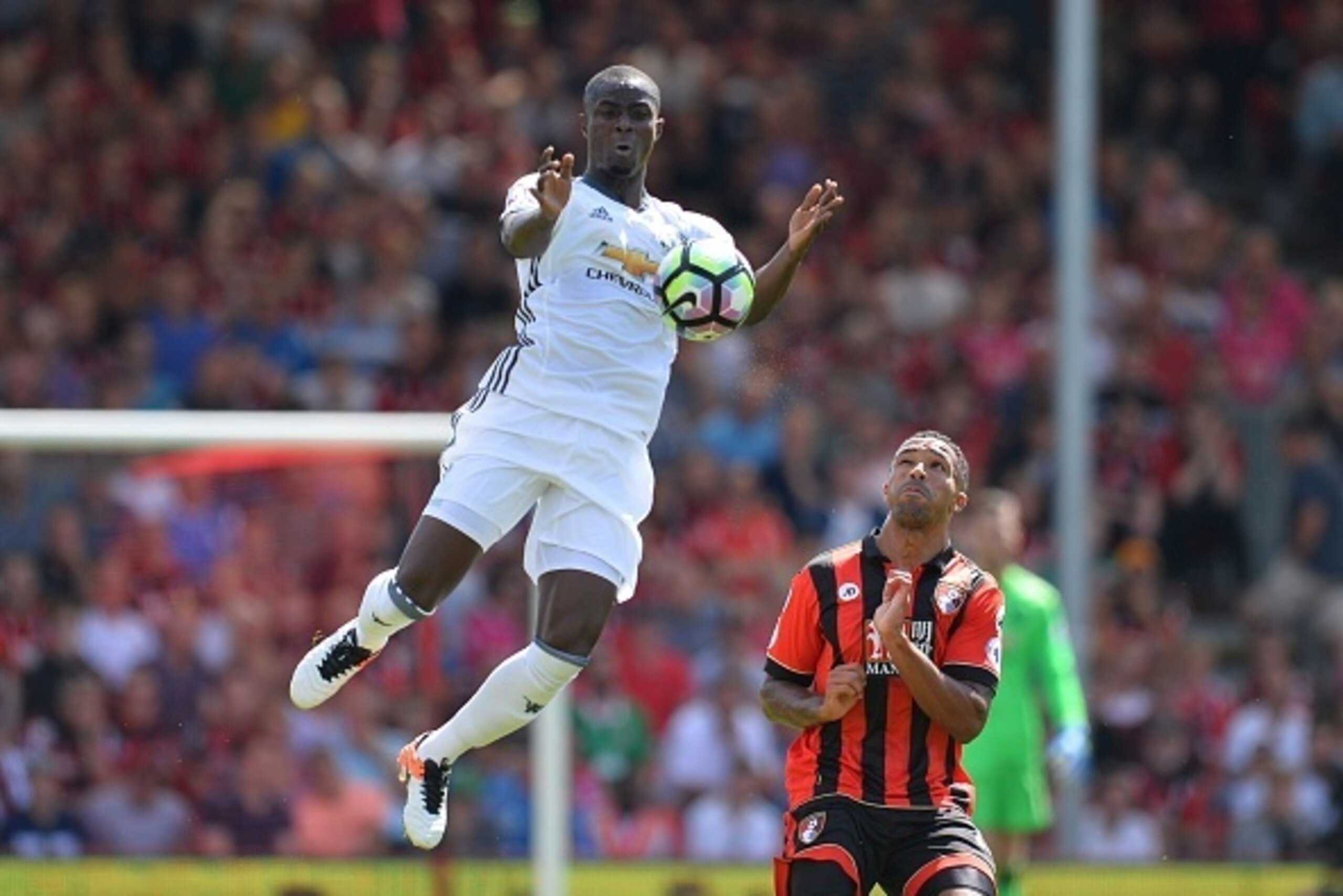 Manchester United's Ivorian defender Eric Bailly (L) leaps to control the ball next to Bournemouth's English striker Callum Wilson (R) during the English Premier League football match between Bournemouth and Manchester United at the Vitality Stadium in Bo Manchester United's Ivorian defender Eric Bailly (L) leaps to control the ball next to Bournemouth's English striker Callum Wilson (R) during the English Premier League football match between Bournemouth and Manchester United at the Vitality Stadium in Bo