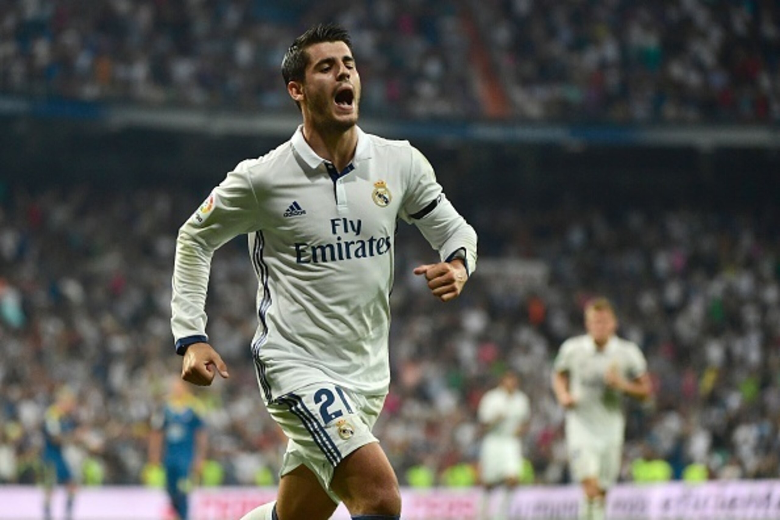 Real Madrid's forward Alvaro Morata celebrates after scoring during the Spanish league football match Real Madrid CF vs RC Celta de Vigo at the Santiago Bernabeu stadium in Madrid on August 27, 2016. / AFP / PIERRE-PHILIPPE MARCOU        (Photo credit sho