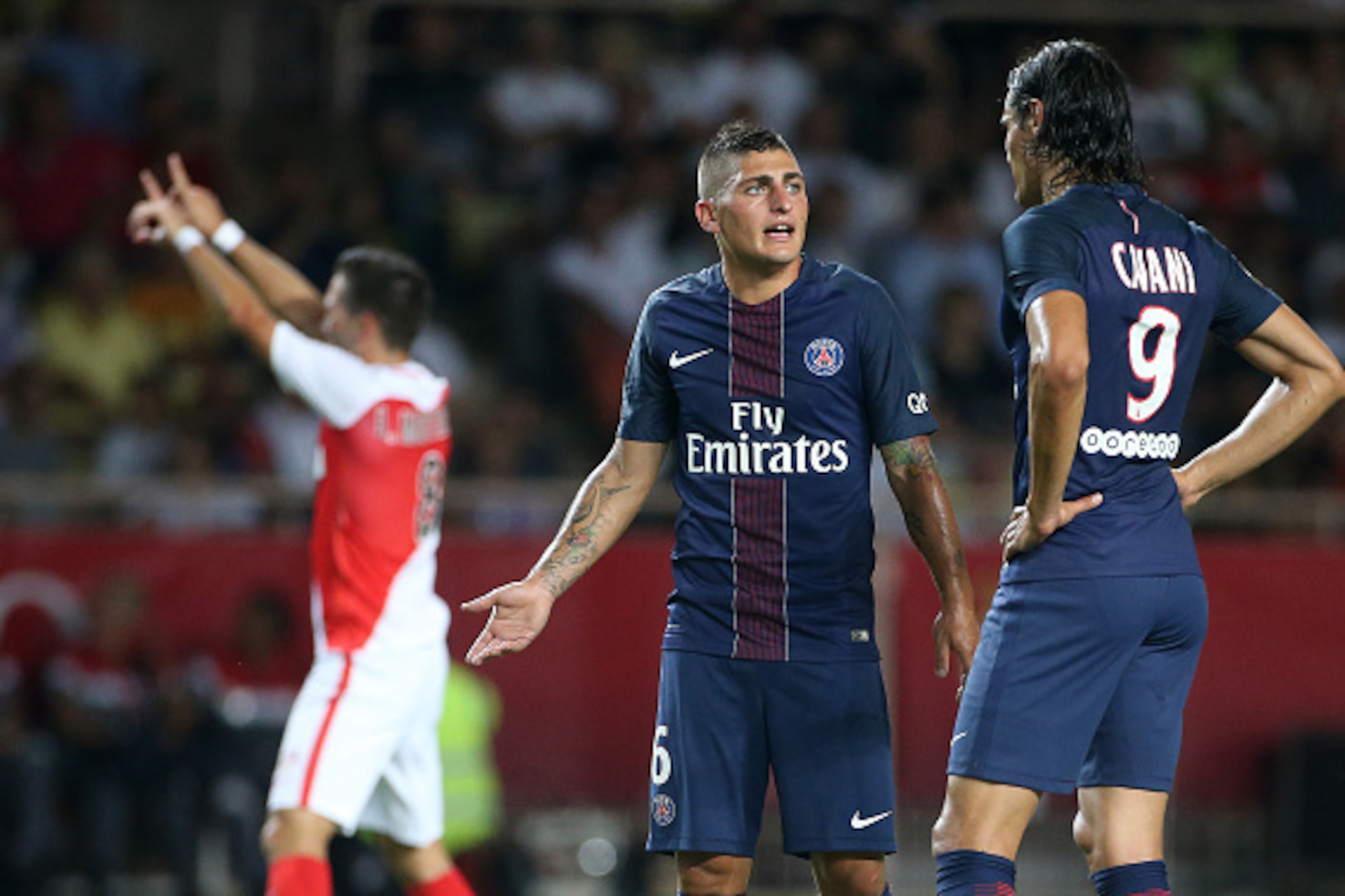 MONACO, MONACO - AUGUST 28: Marco Verratti and Edinson Cavani of PSG react while Joao Moutinho of Monaco (#8) in the background celebrates his goal during the French Ligue 1 match between AS Monaco (ASM) and Paris Saint-Germain (PSG) at Stade Louis II on 