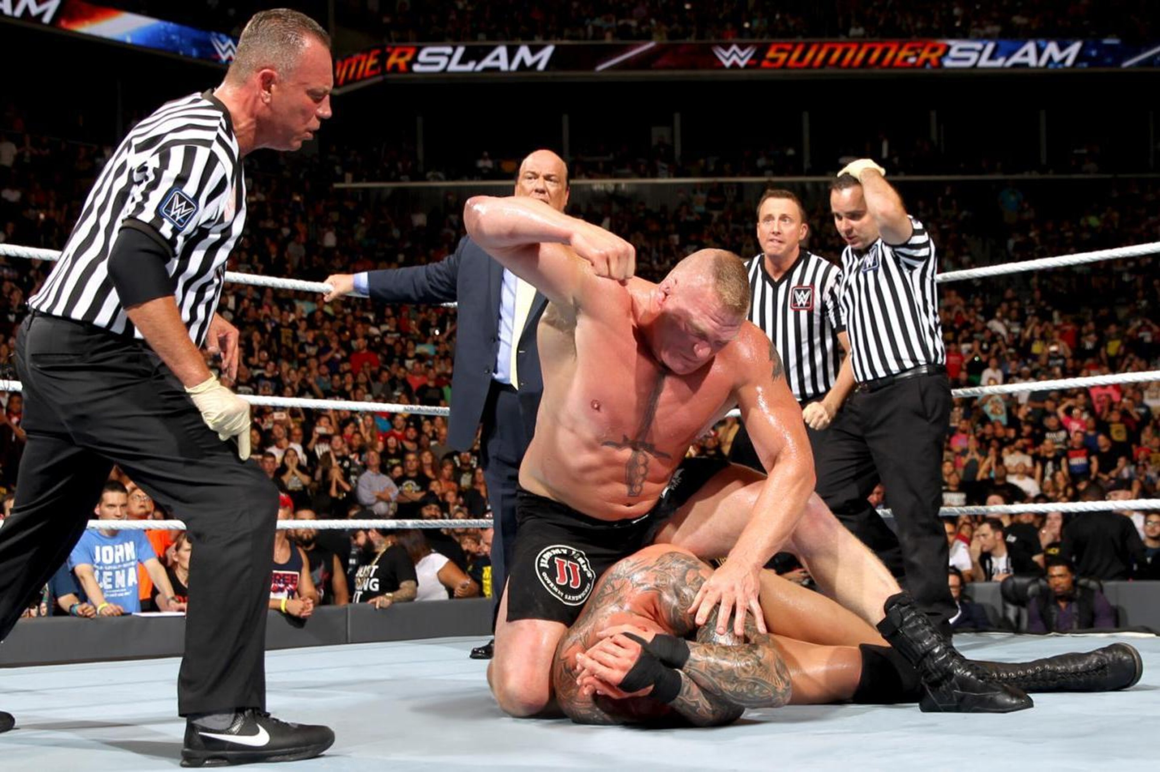 Brock Lesnar beats on Randy Orton at SummerSlam.