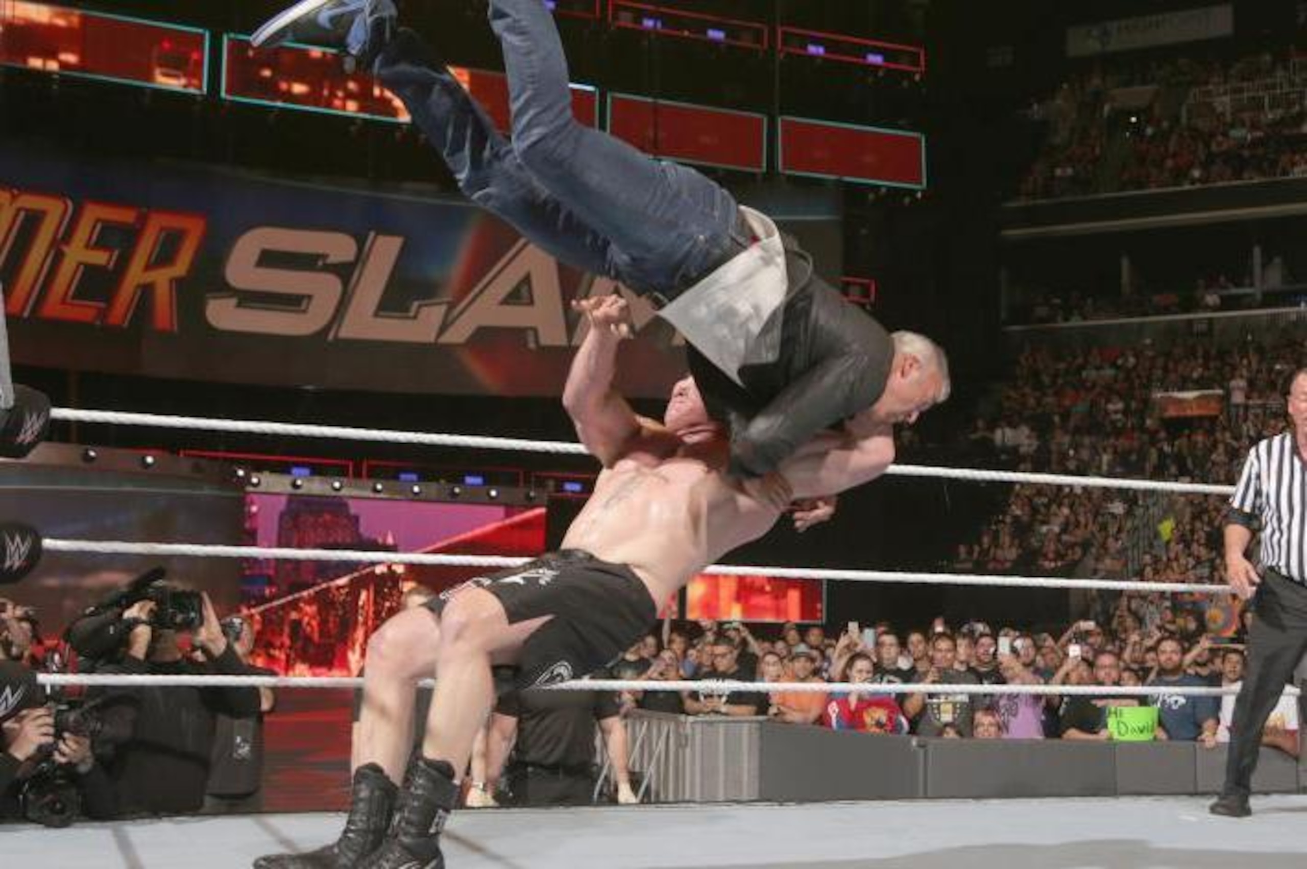 Brock Lesnar sends Shane McMahon on a painful ride. Brock Lesnar sends Shane McMahon on a painful ride.